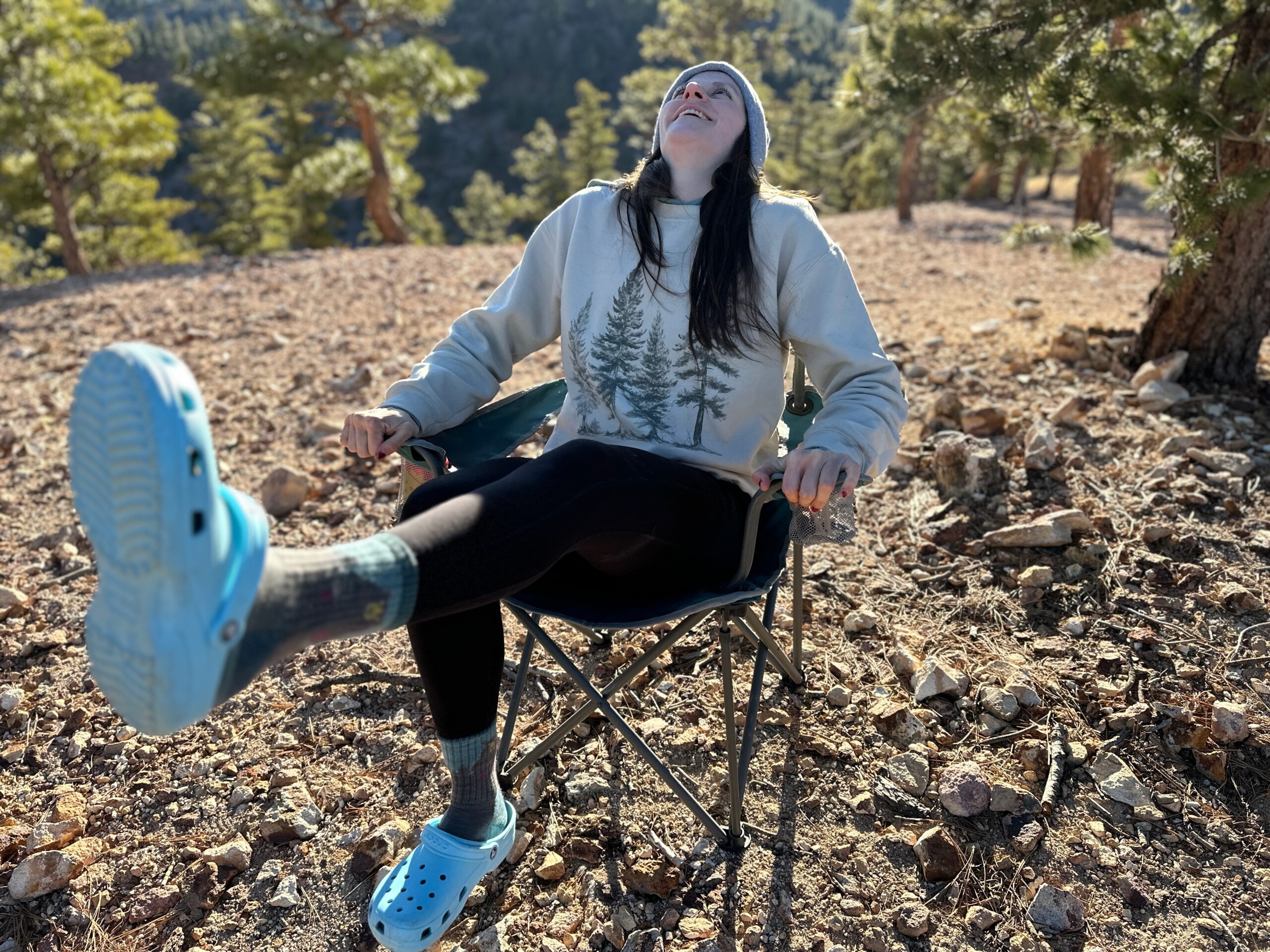 the Crocs Classic Clogs in blue traveling around a camp site in the high desert showing off its versatility and fit