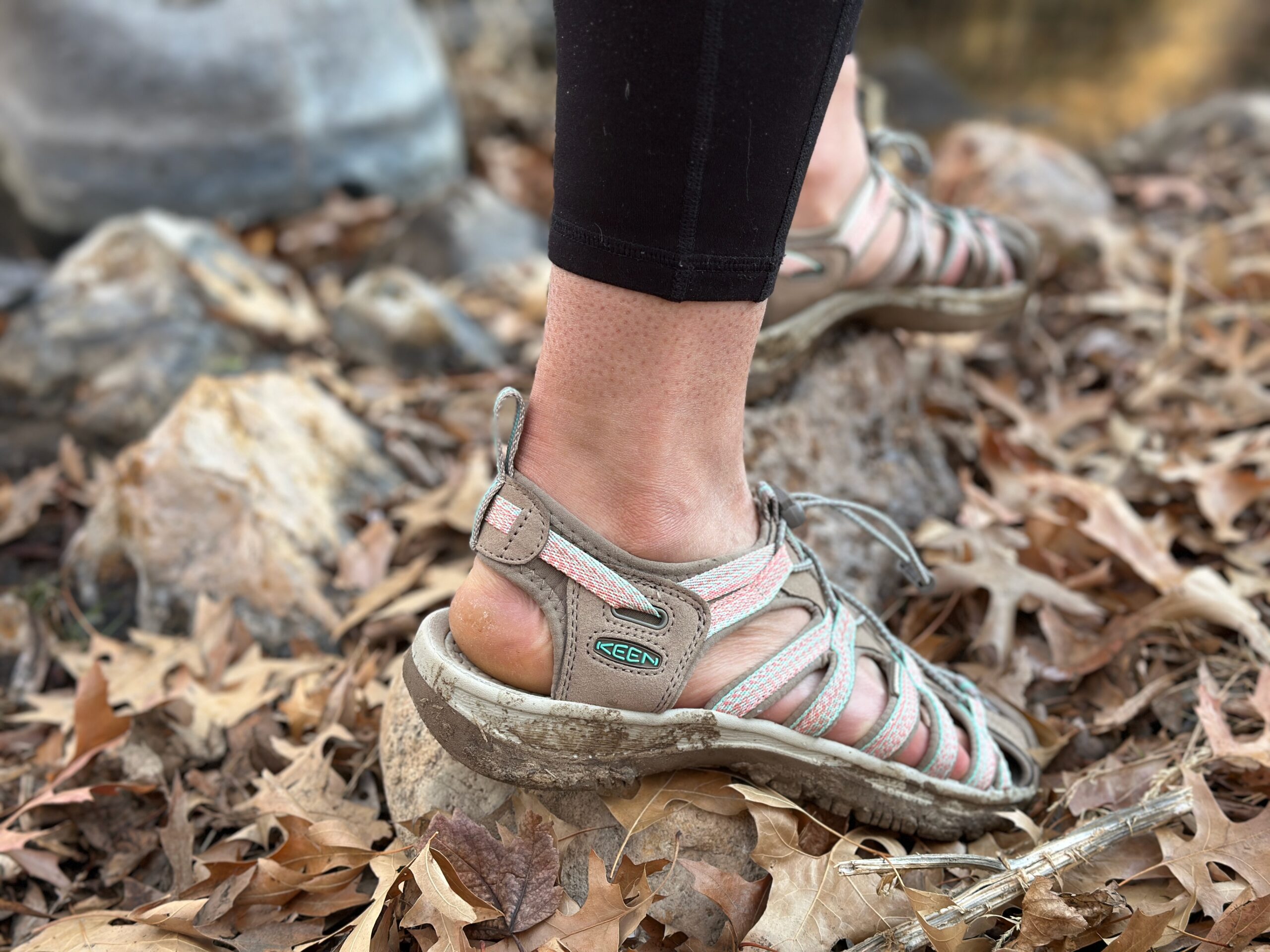 a woman wears the Keen Whisper to show off how the shoes fit