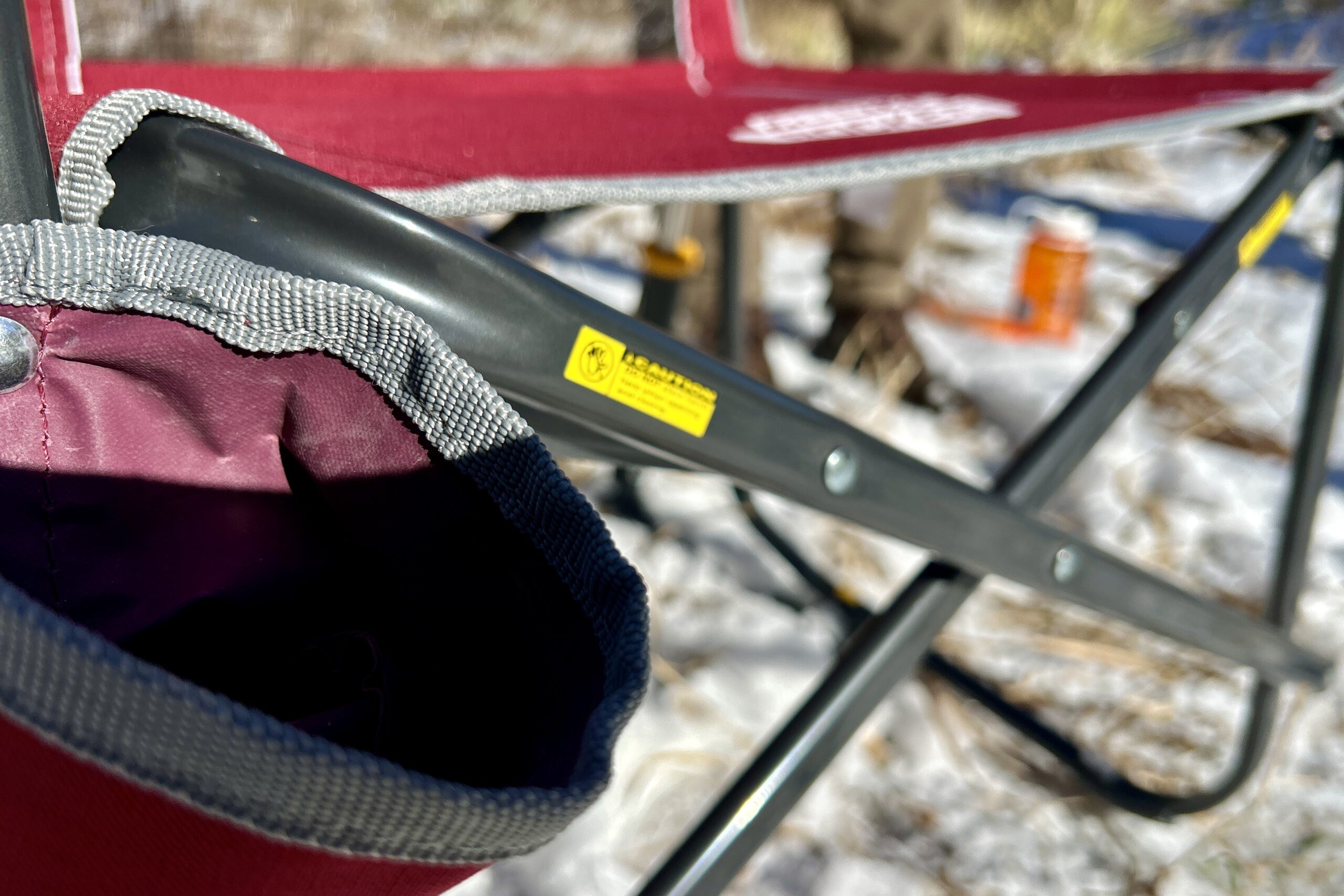 Close-up of the frame and fabric and stitching on a camping chair.