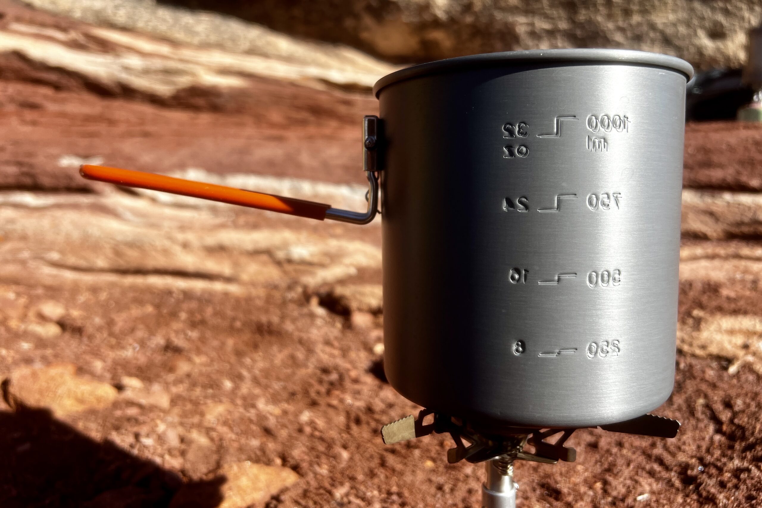 A close up of the gsi halulite boiler and its measurement markings against a red rocks background.