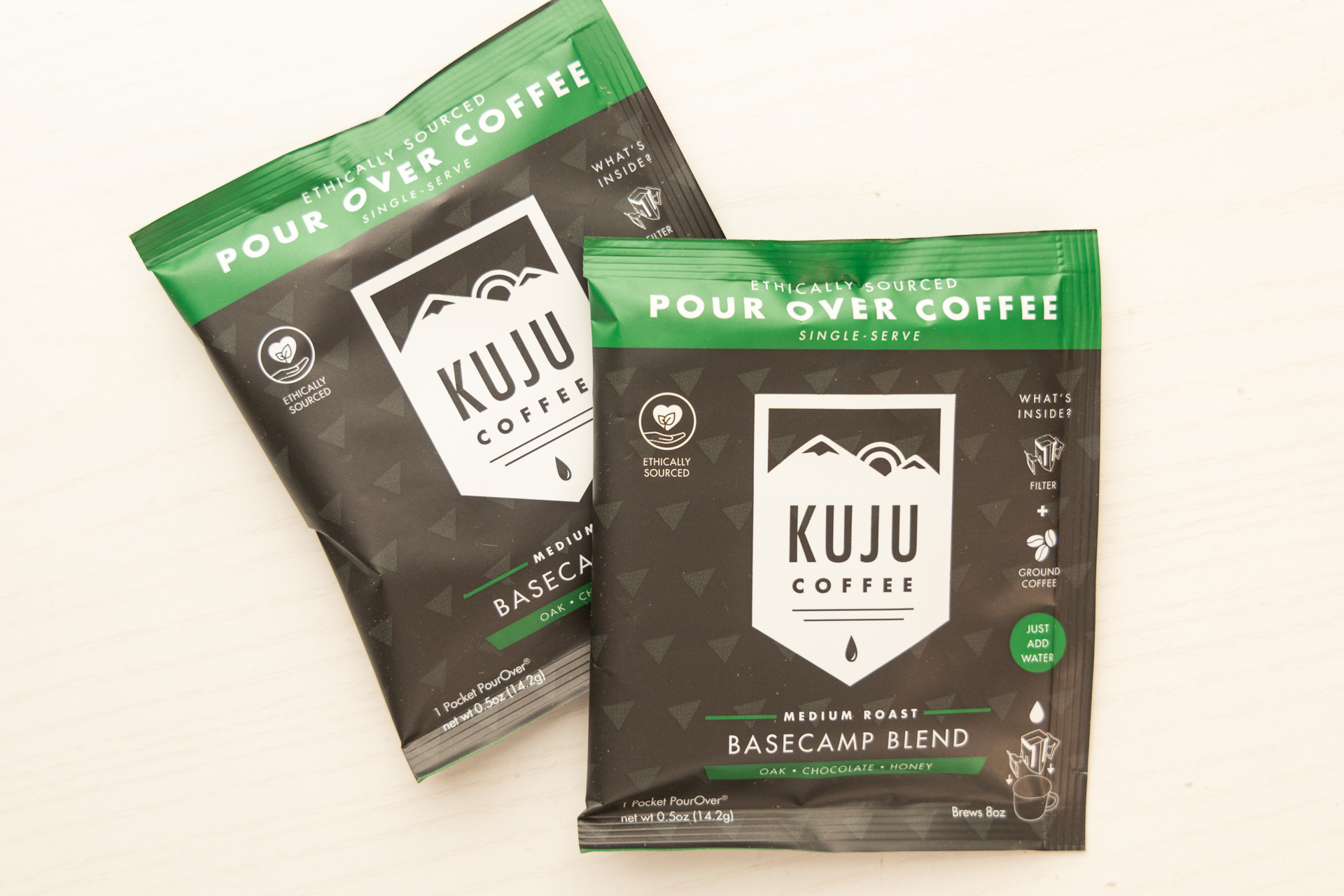 Two Kuju Single-Serve Pour-Over packets.