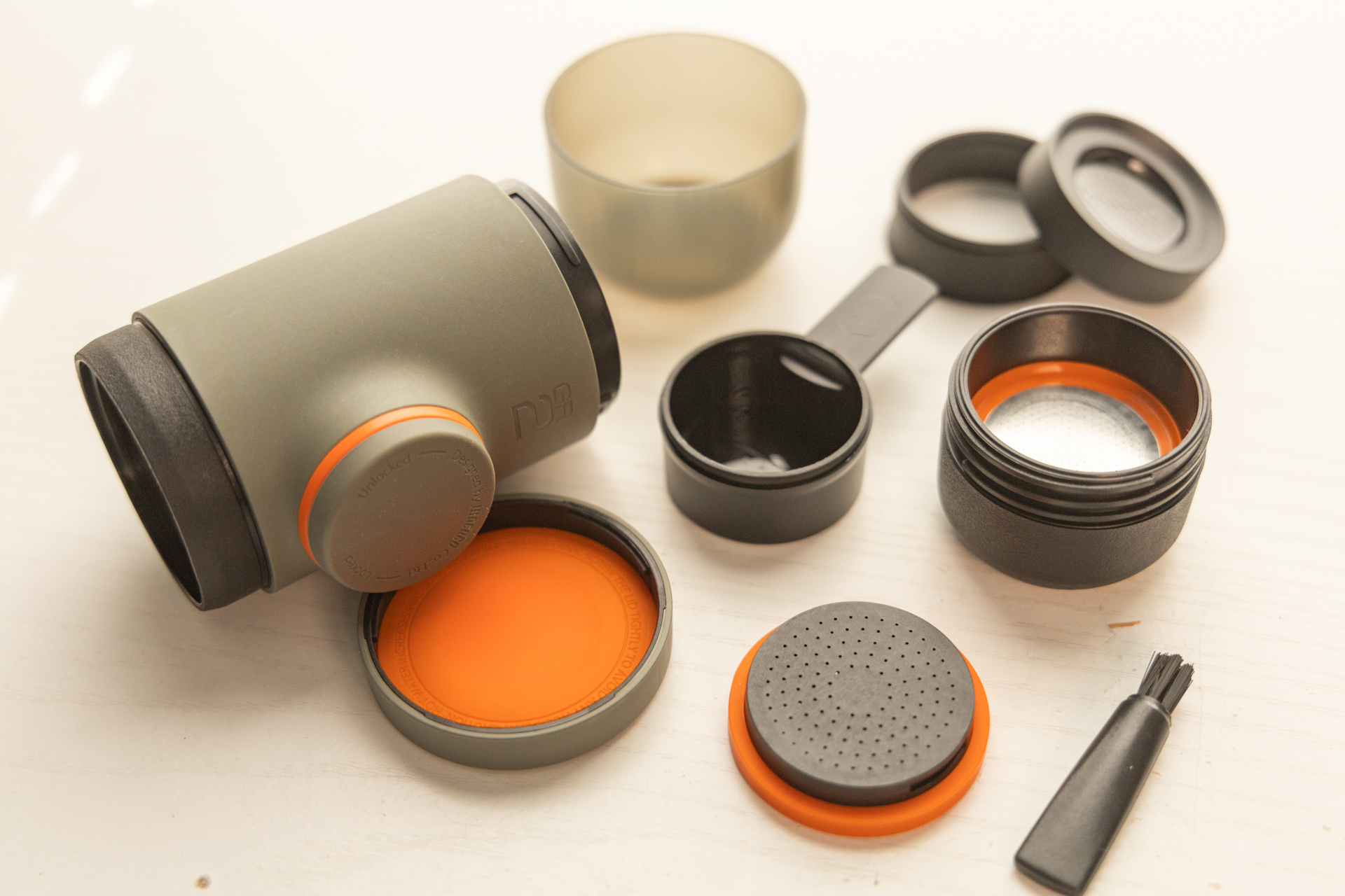 The many parts of the Wacaco Minipresso disassembled.