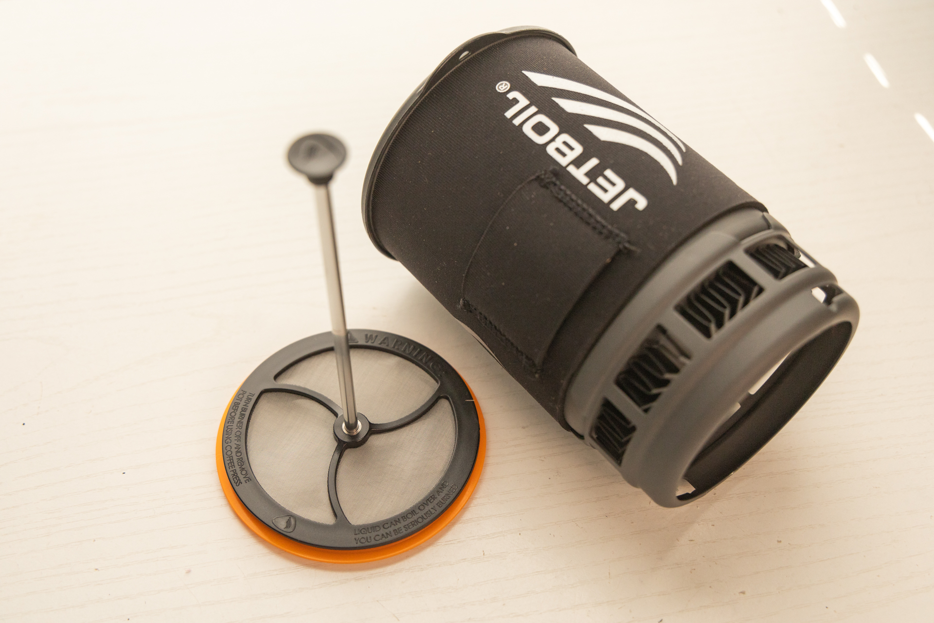 The Jetboil Silicone Coffee Press filter and plunger with Jetboil pot