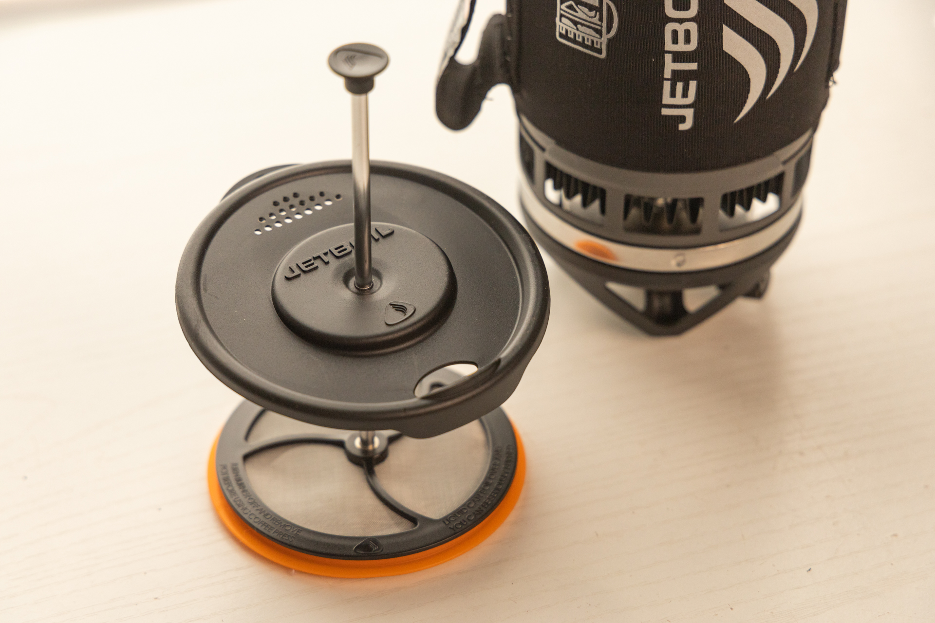 The Jetboil Silicone Coffee Press lid, filter, and plunger.