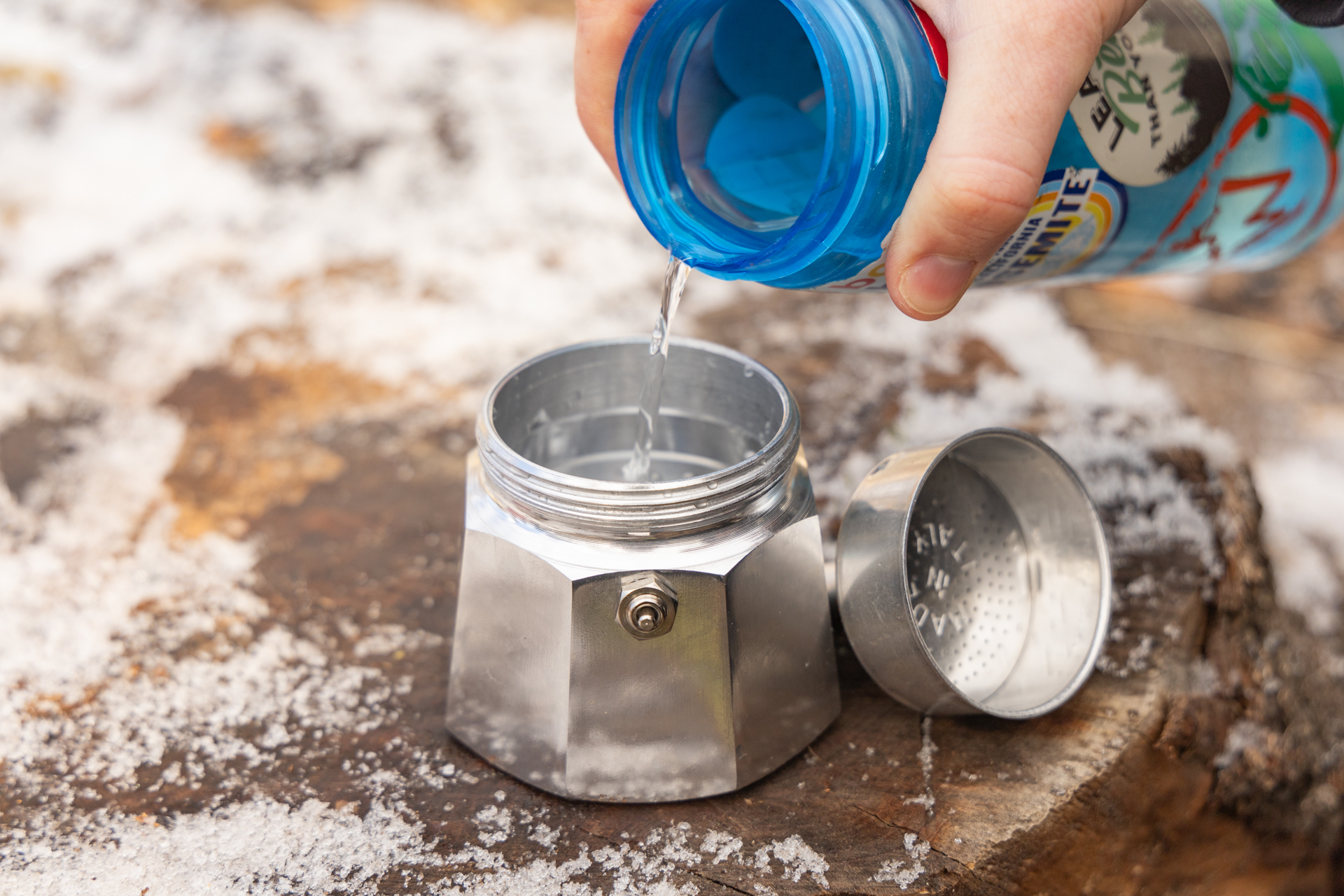 Pouring water into the base of the Bialetti Moka Express.