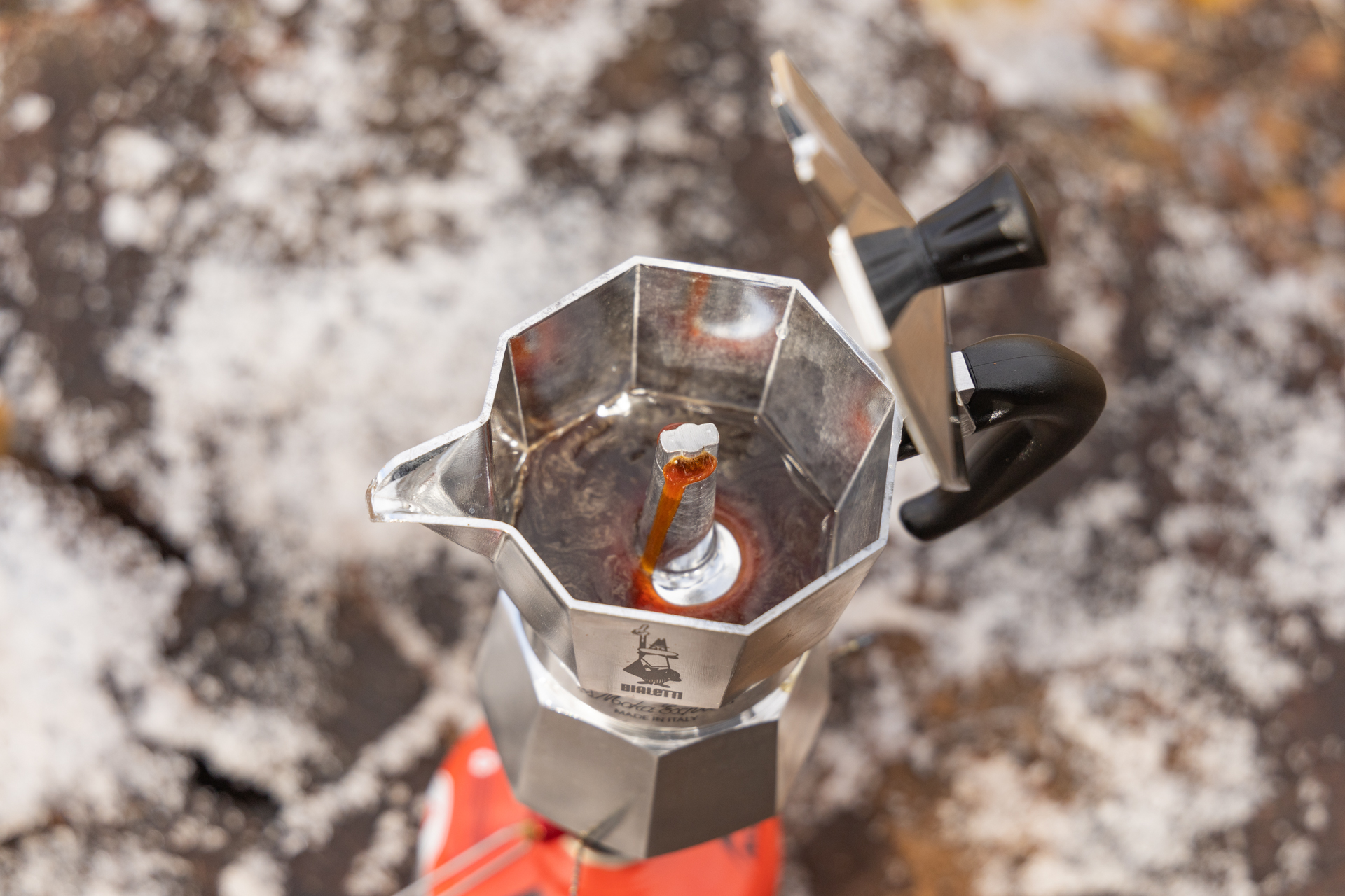 Coffee pouring into the upper reservoir of the Bialetti Moka Express.