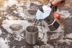 Pouring coffee into a mug from the Bialetti Moka Express.