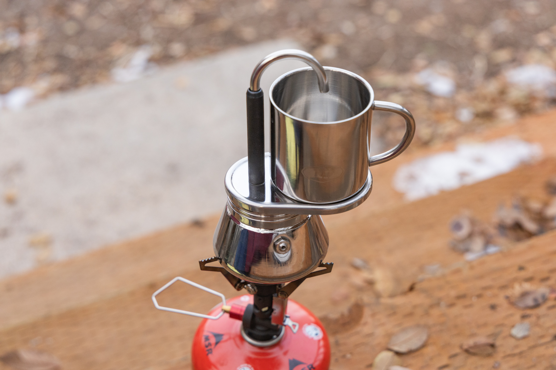 The GSI Mini Espresso sitting atop a backpacking stove.