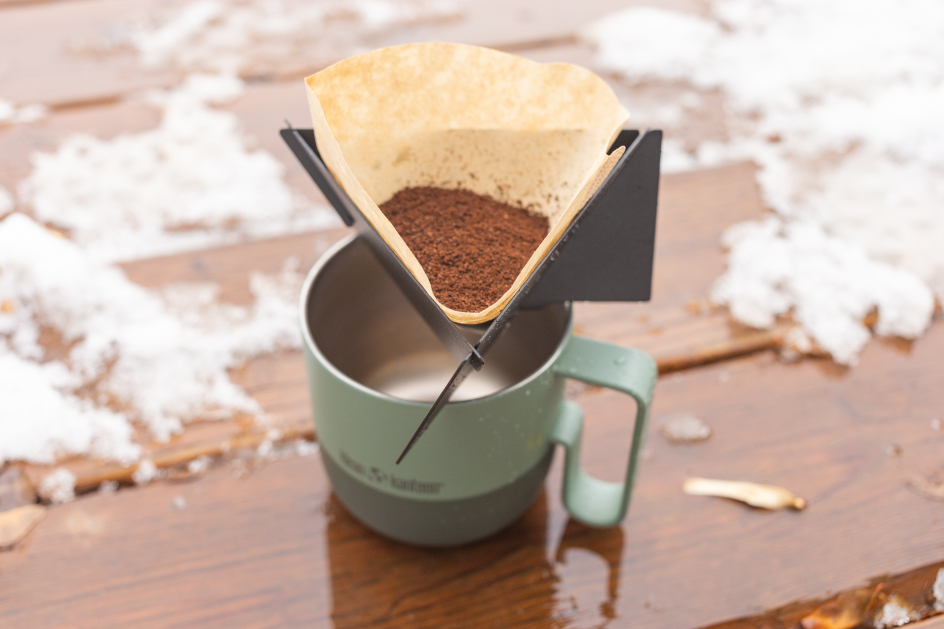 Dry coffee grounds in a filter in the MiiR Pourigami.
