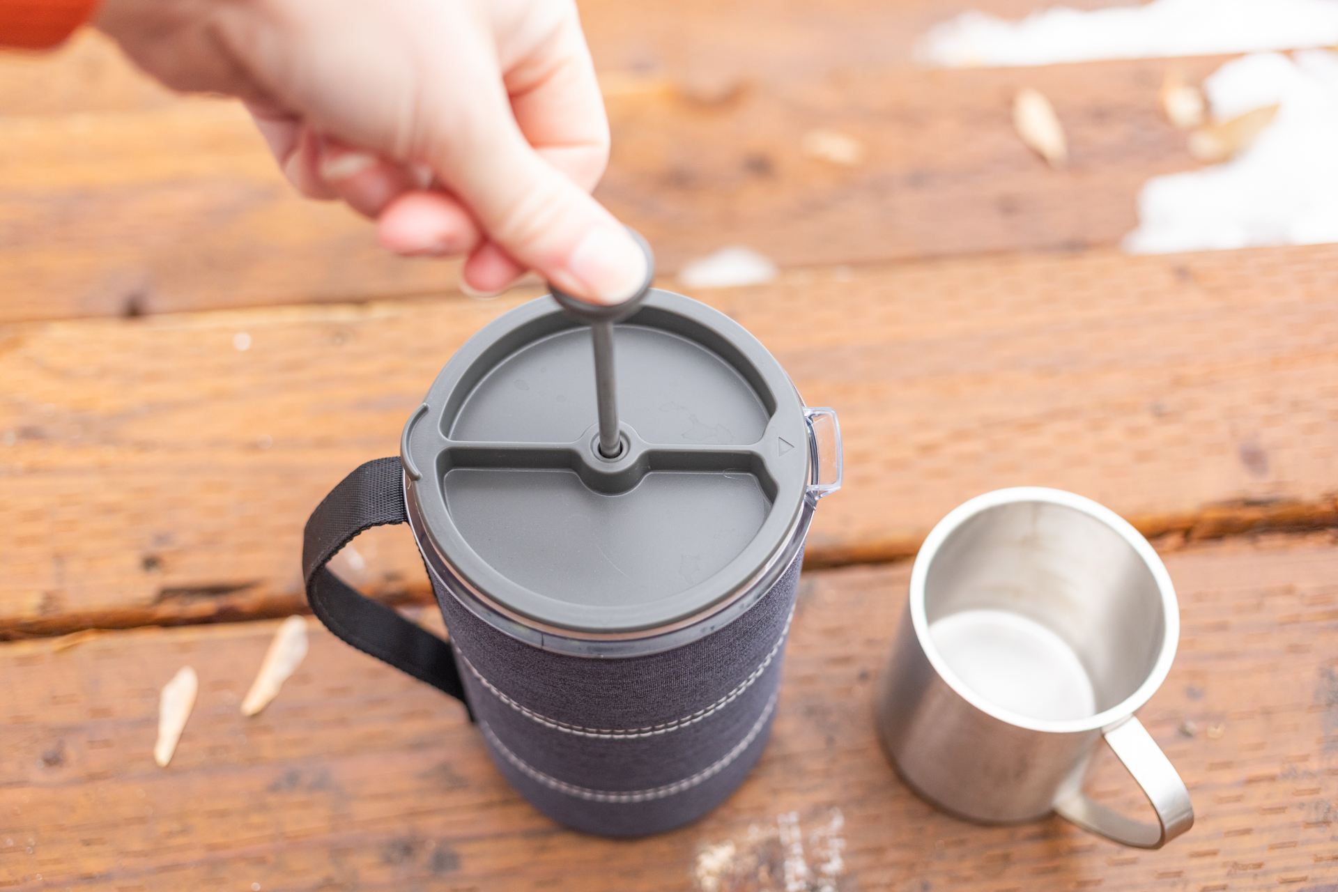 A hand depressed the plunger on a GSI Java Press.