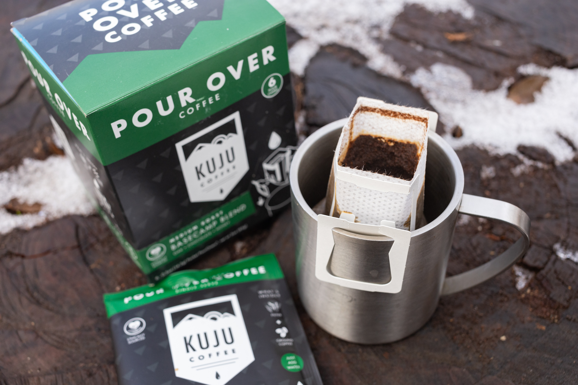A Kuju coffee pouch sitting in a mug.