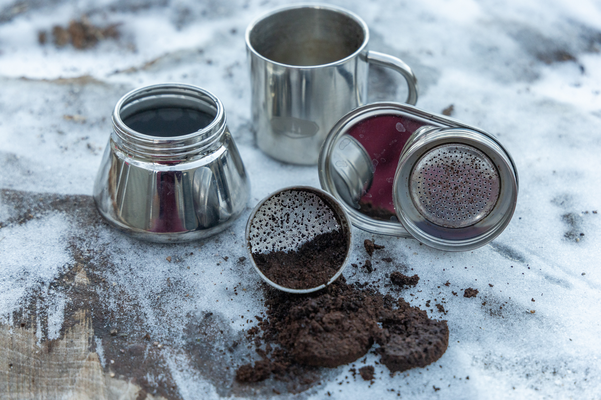The GSI Mini Espresso disassembled to see coffee grounds and cleanup required.
