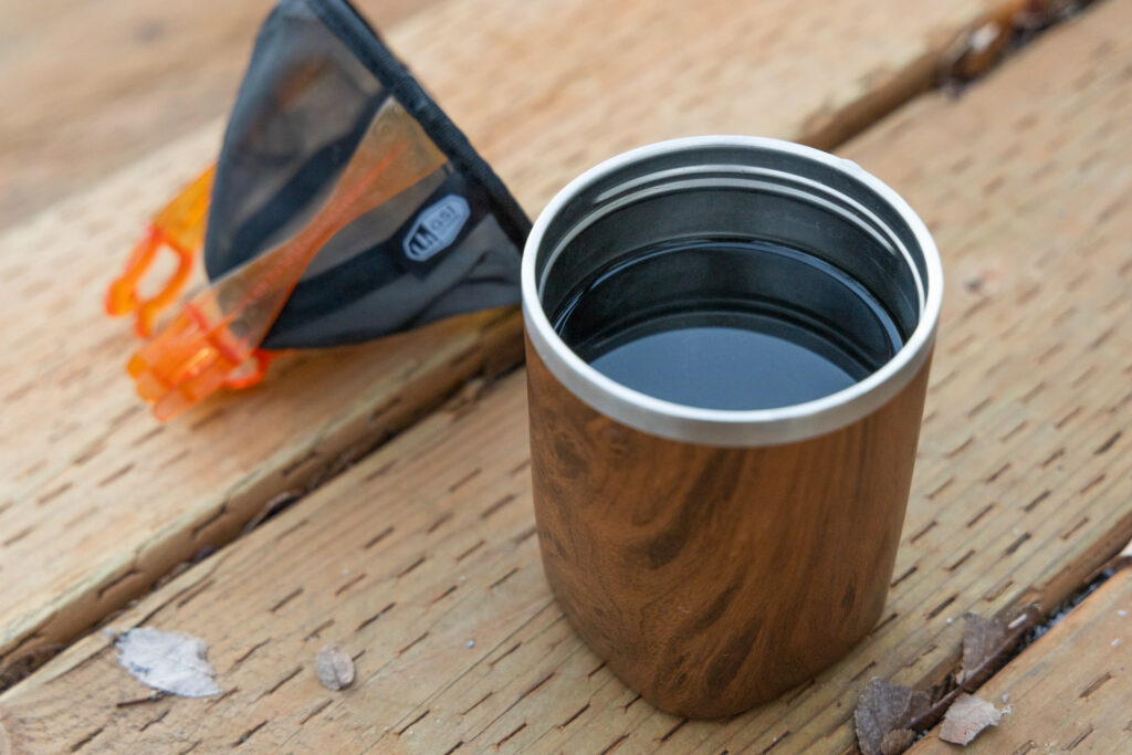 A mug full of coffee.