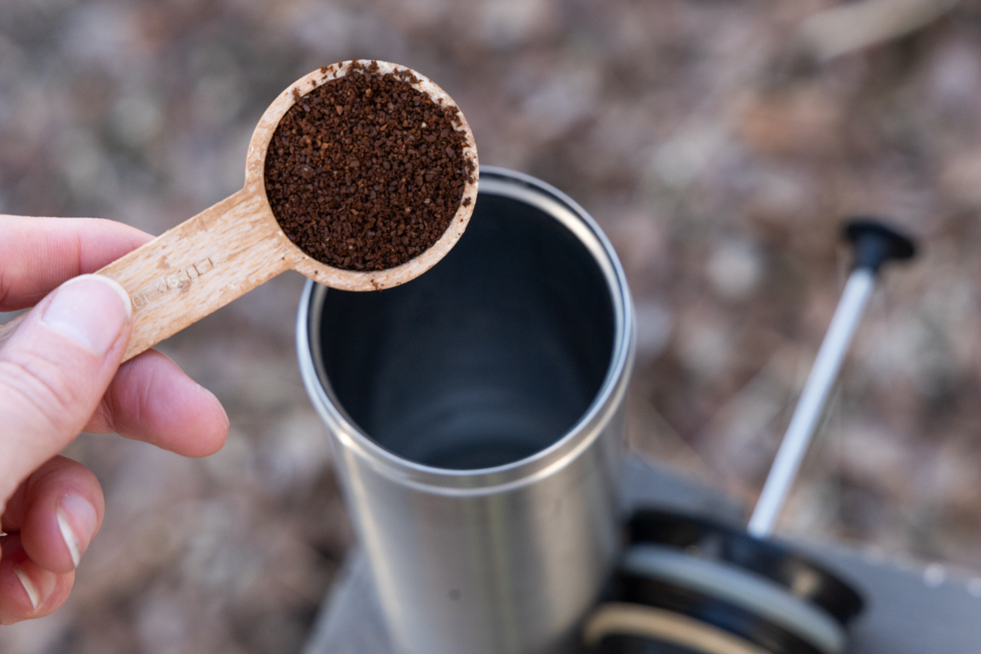 Scooping coffee into an ESPRO bottle.