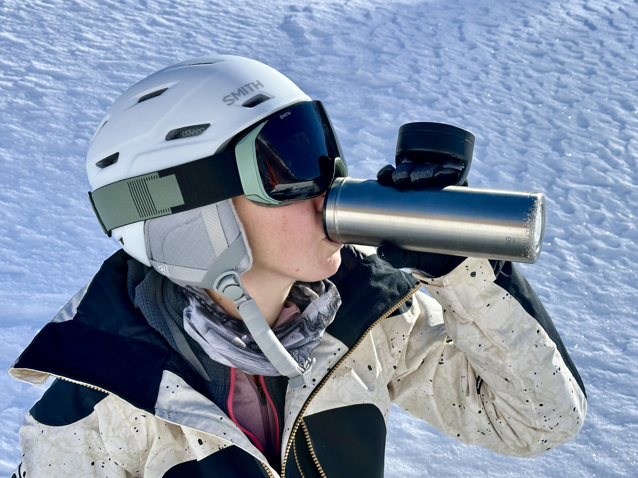 A woman drinks from an ESPRO bottle.