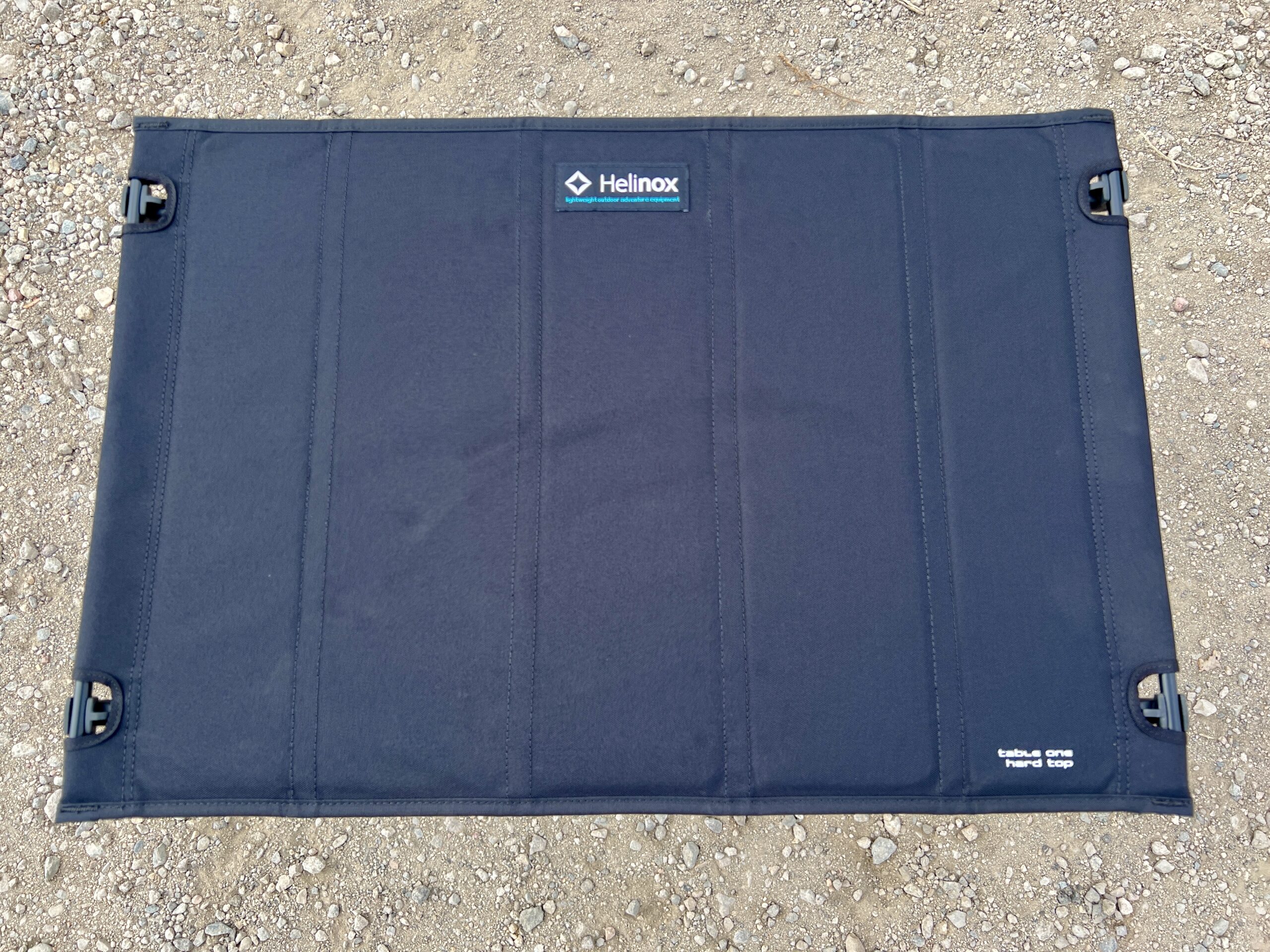The Helinox One Hard Top stands on dirt.