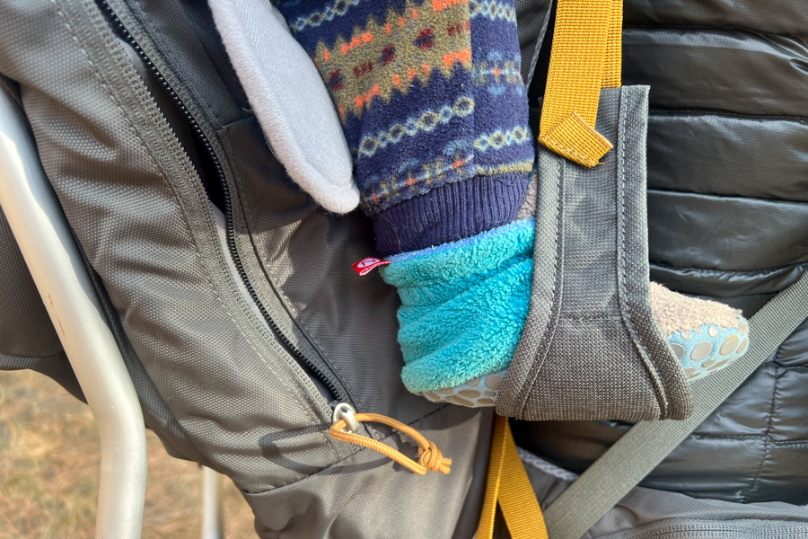 Close-up of a child’s foot resting in the foot stirrup of the Kelty PerfectFIT Journey Elite.