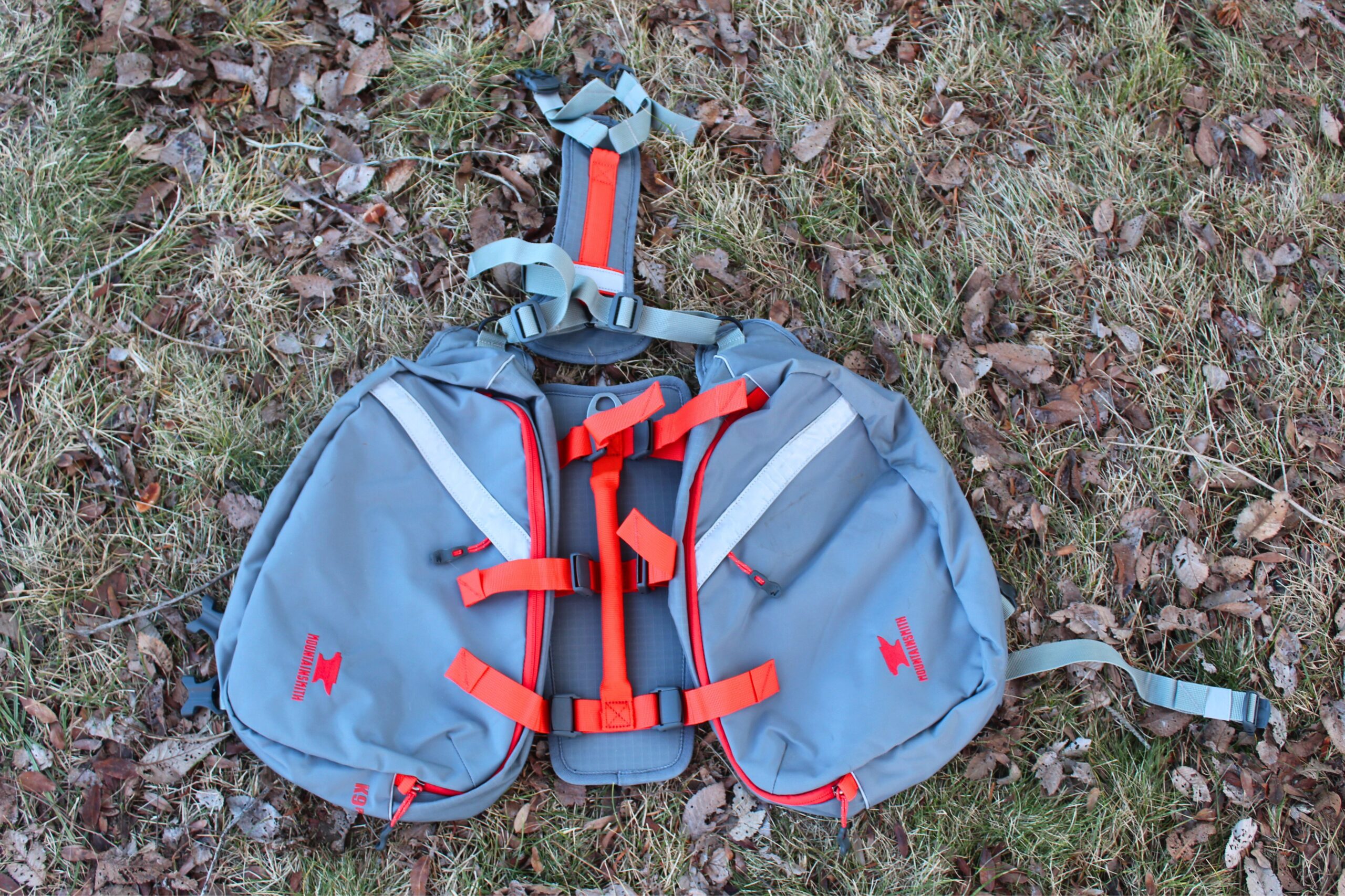 The Mountainsmith K9 Dog Backpack laid out on the ground