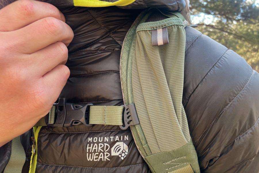 A close-up of the shoulder strap and chest buckle on the Osprey Poco Premium, emphasizing its durable build and secure fit.