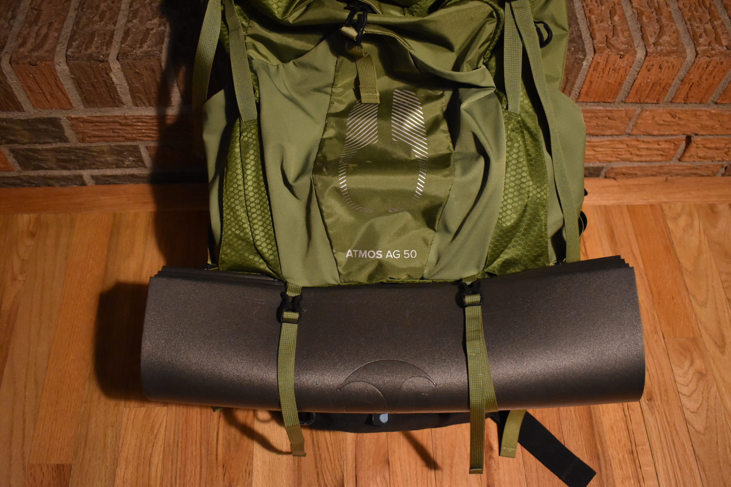 close up of the pad strapped to the bottom of a 50 liter backpack