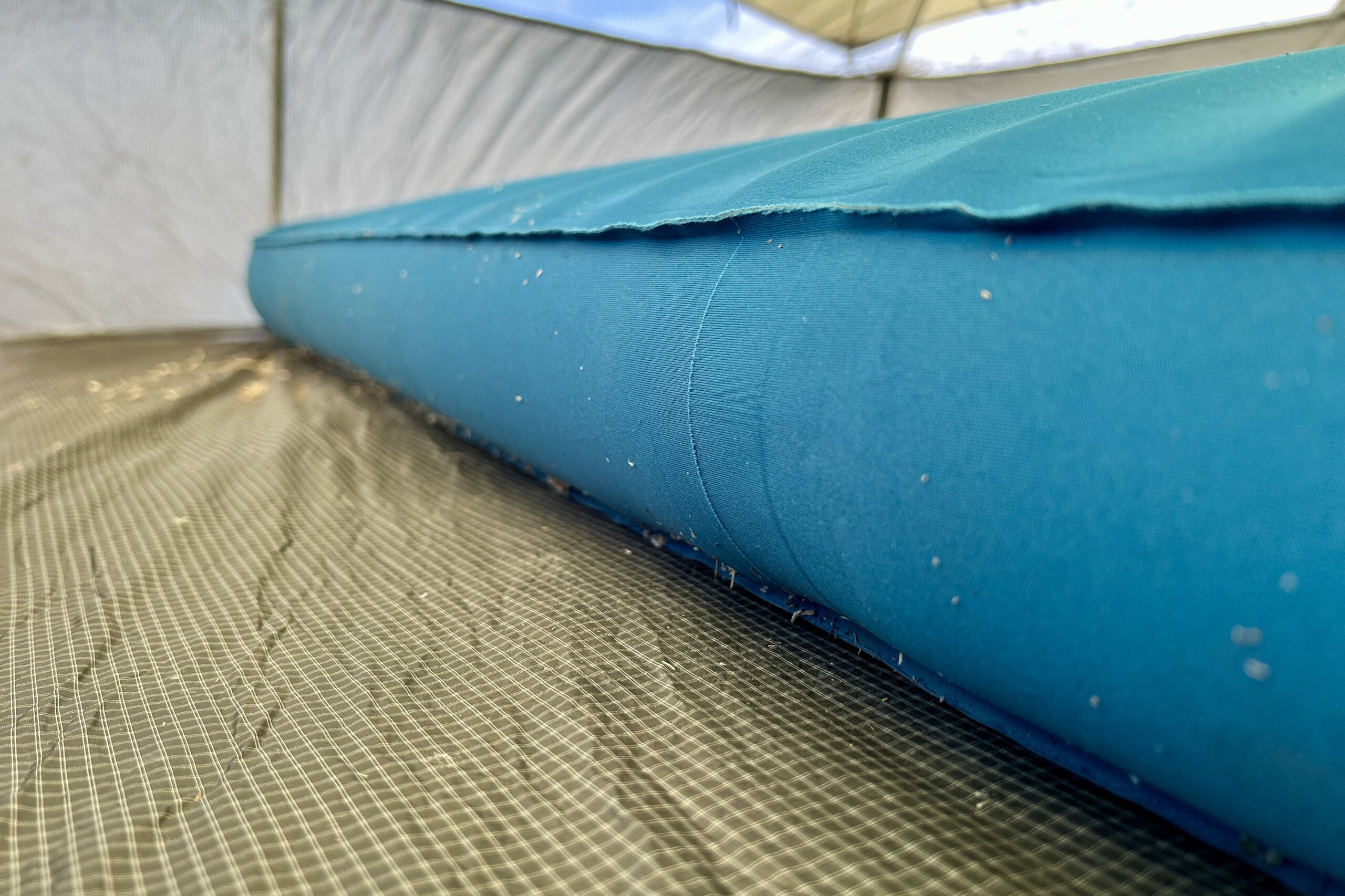 Close-up image of a camping mattress's thick side profile.