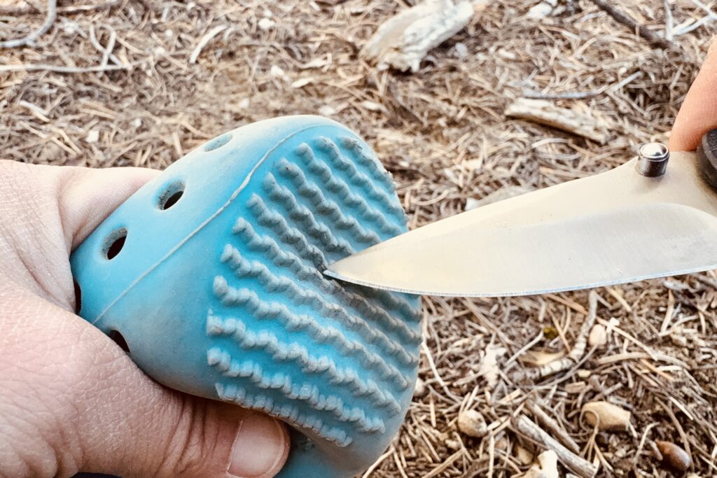 Close up of a WagWellies boot being poked with a knife.