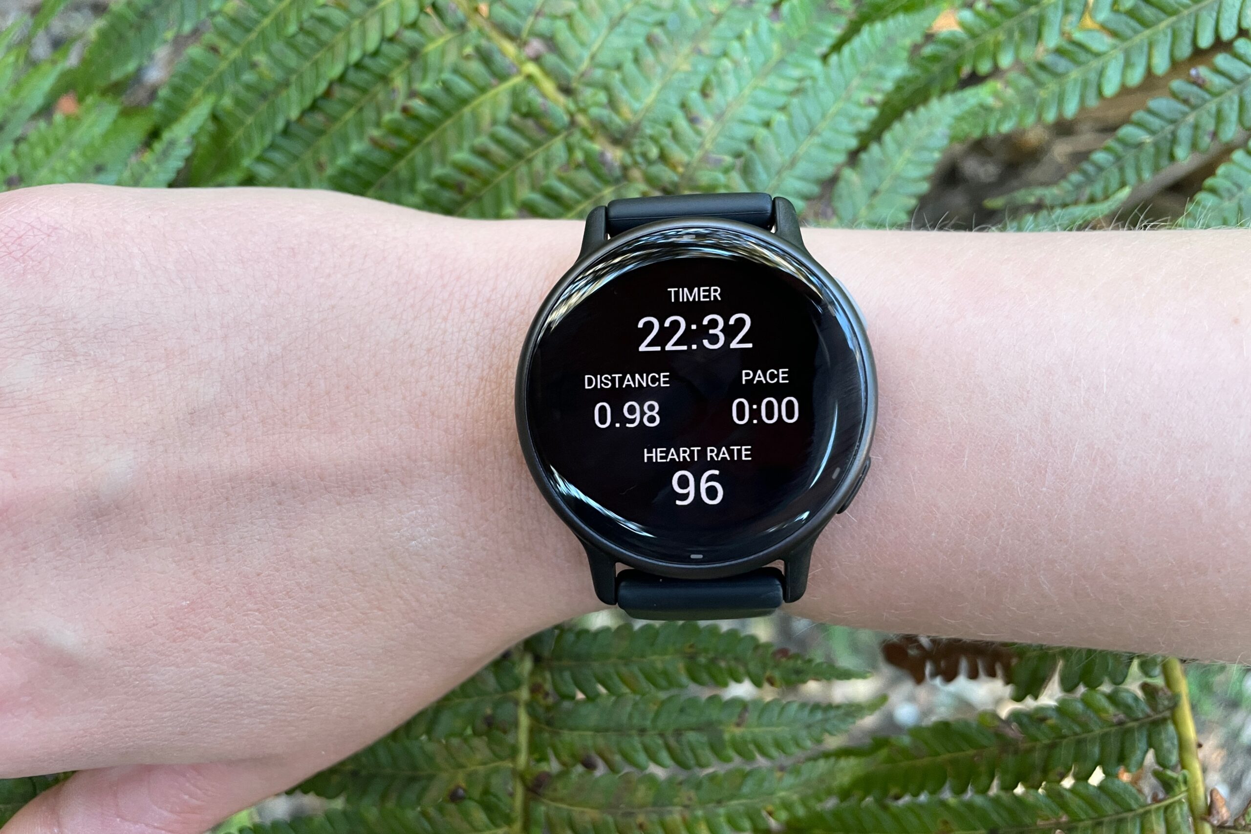 A closeup of workout metrics on a GPS watch.