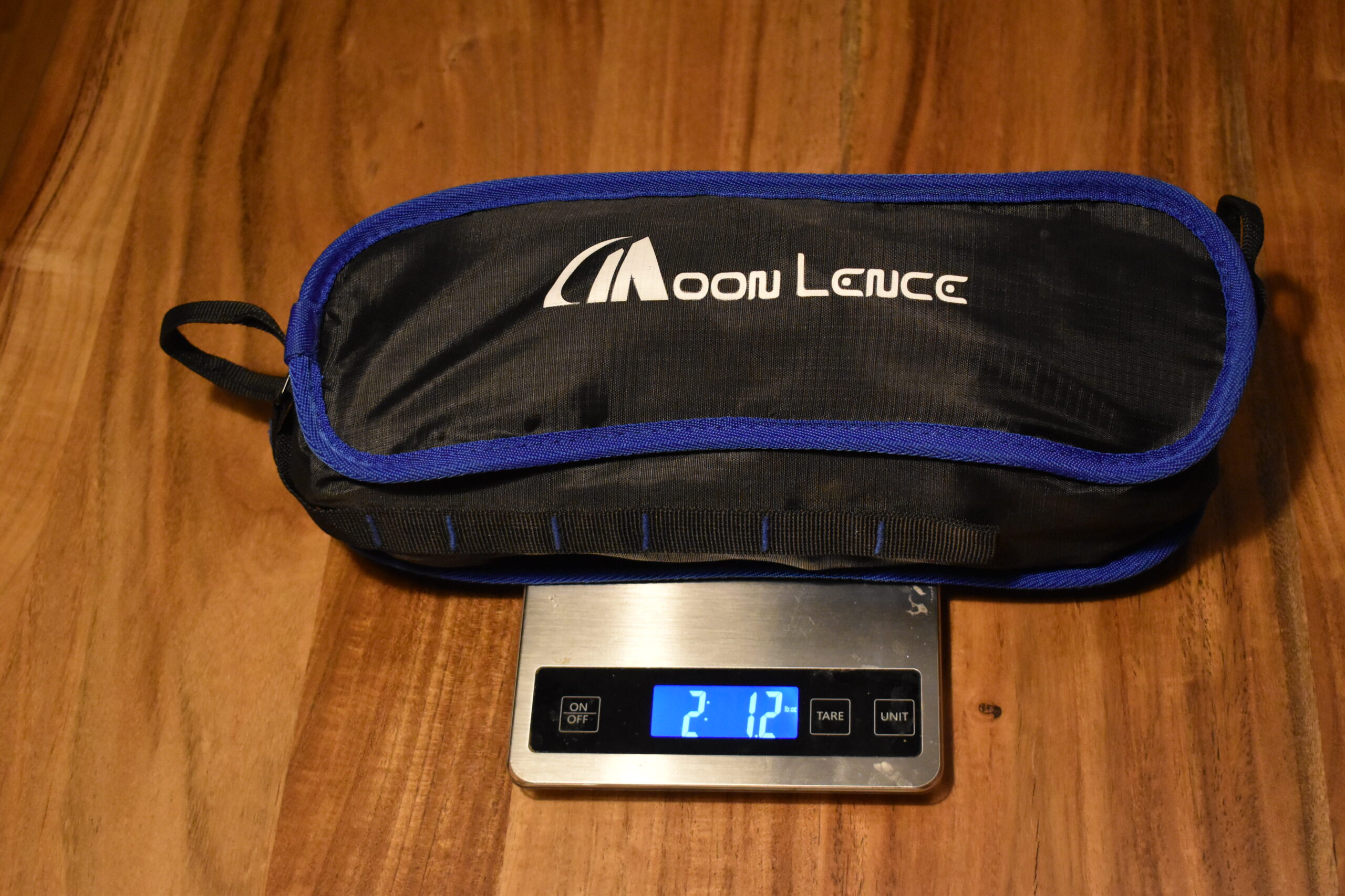 Packed Moon Lence chair sits on a kitchen scale that reads 2 lb 1.2 oz
