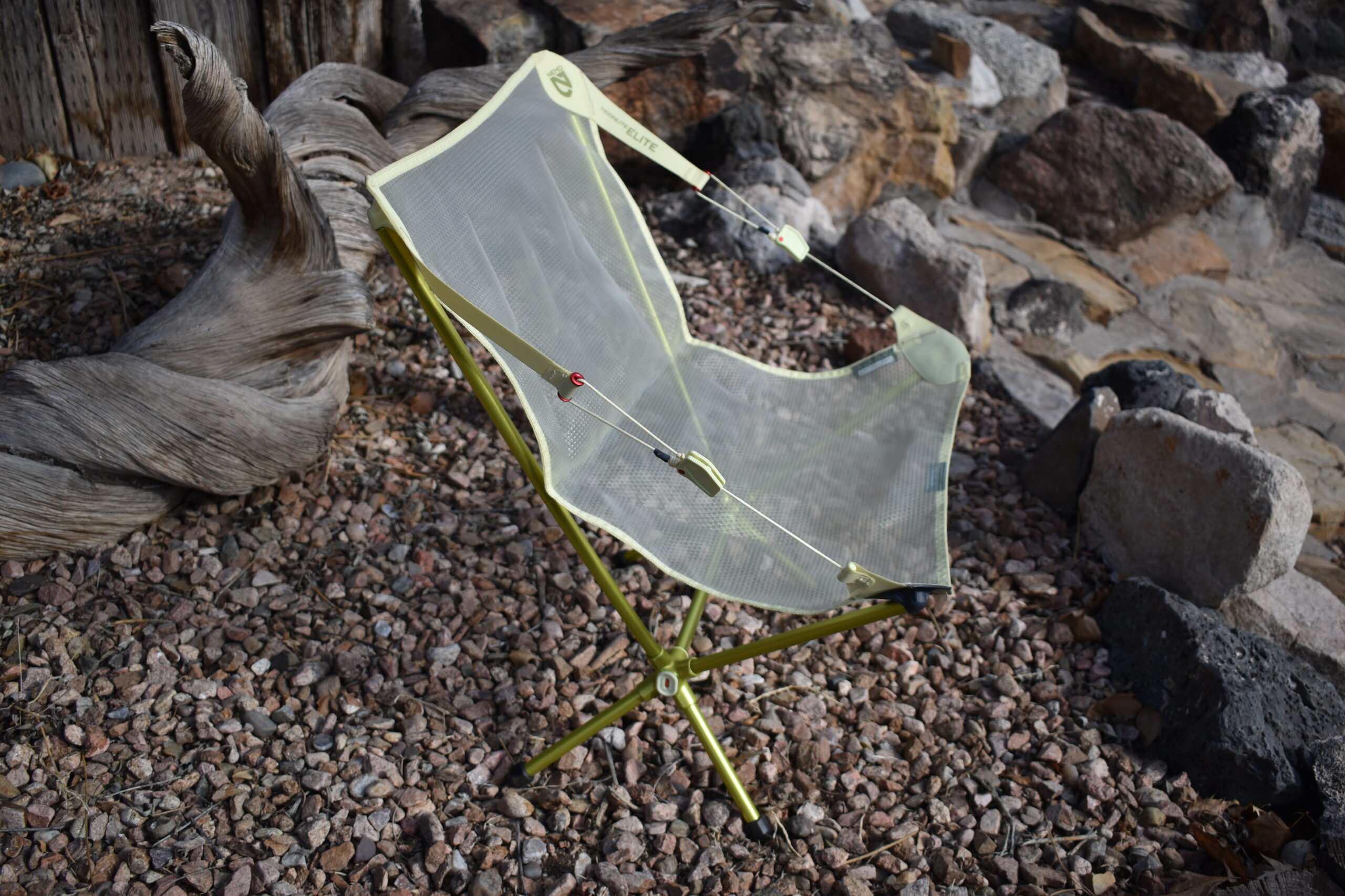 side view of the NEMO Moonlite chair shows the adjustable side cords, which adjusts the chair from an semi-upright to semi-reclined position