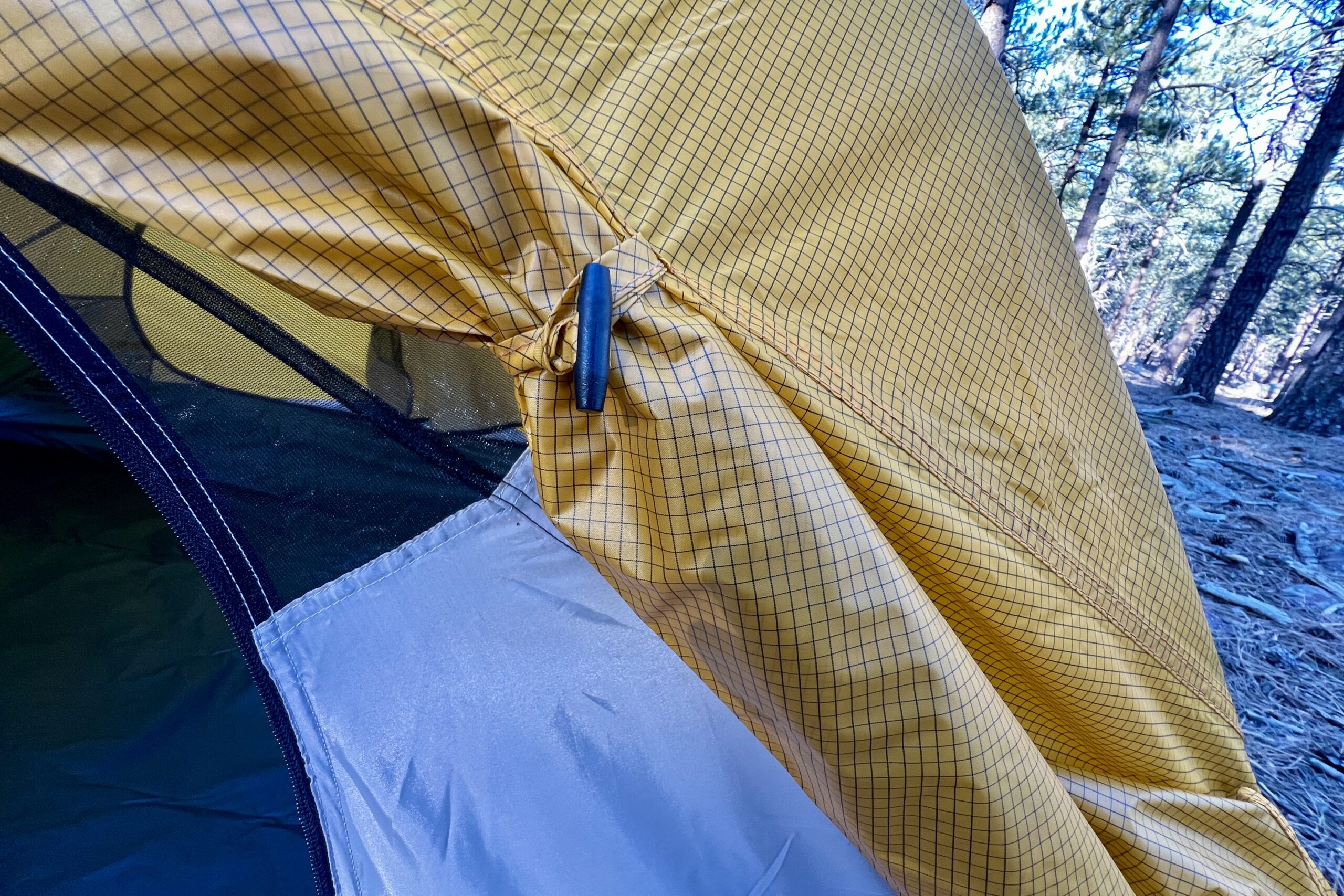 a close up of a door tie back on a tent