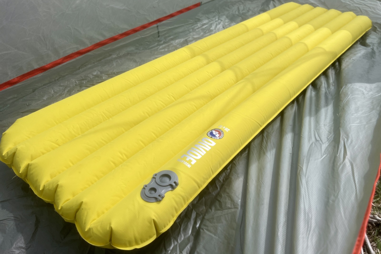a yellow sleeping pad in a tent