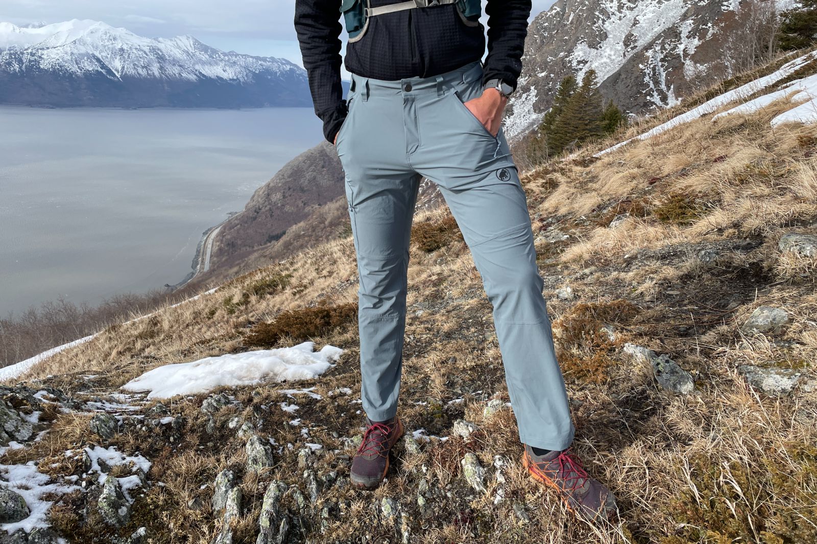A closeup of a pair of pants on a mountain ridge.