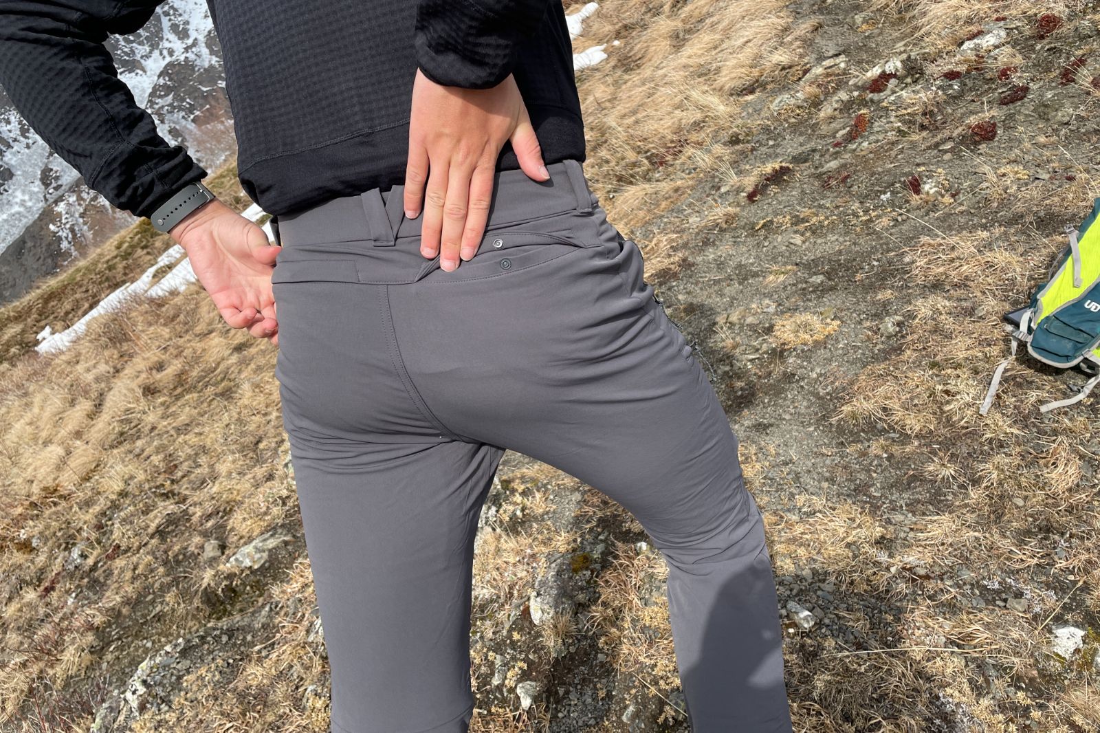 A closeup of the back pockets on a pair of pants.