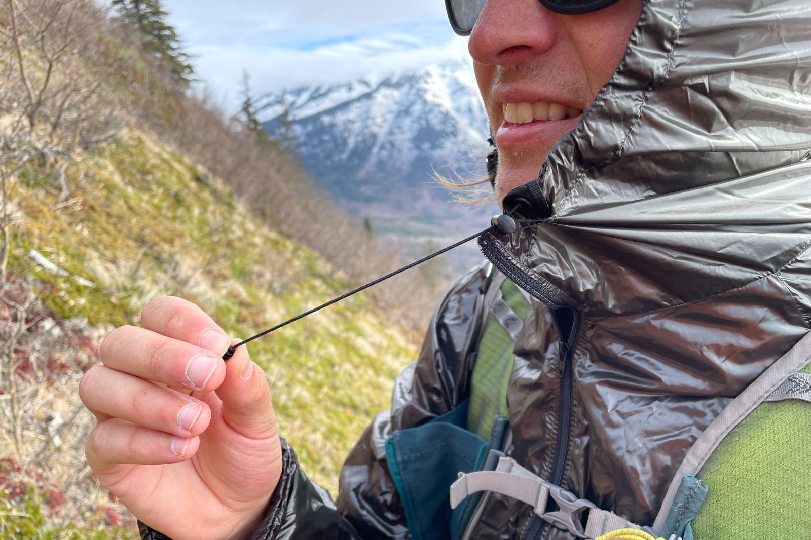 A closeup of the cinches on a windbreaker.