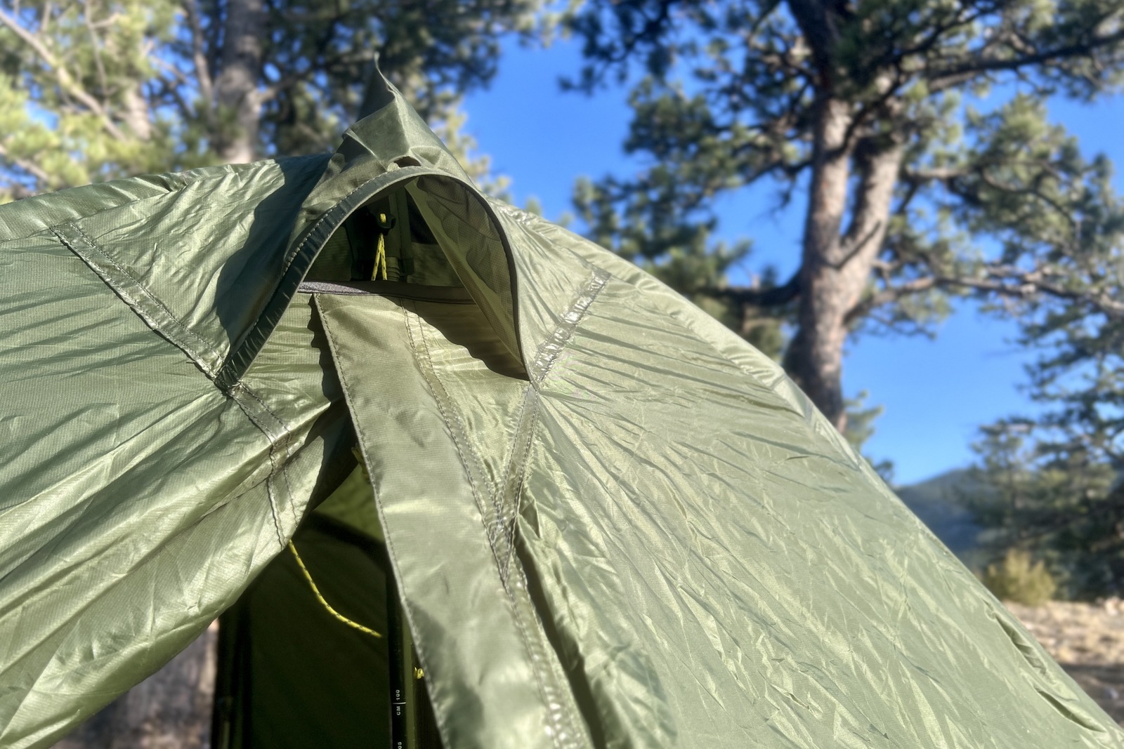 A close up of the ceiling vent on a green a-frame tent