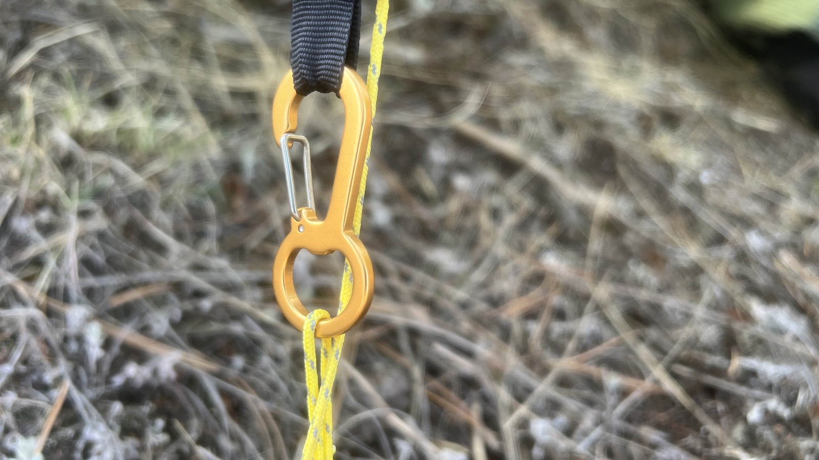 a close up of a carabiner adjustment device