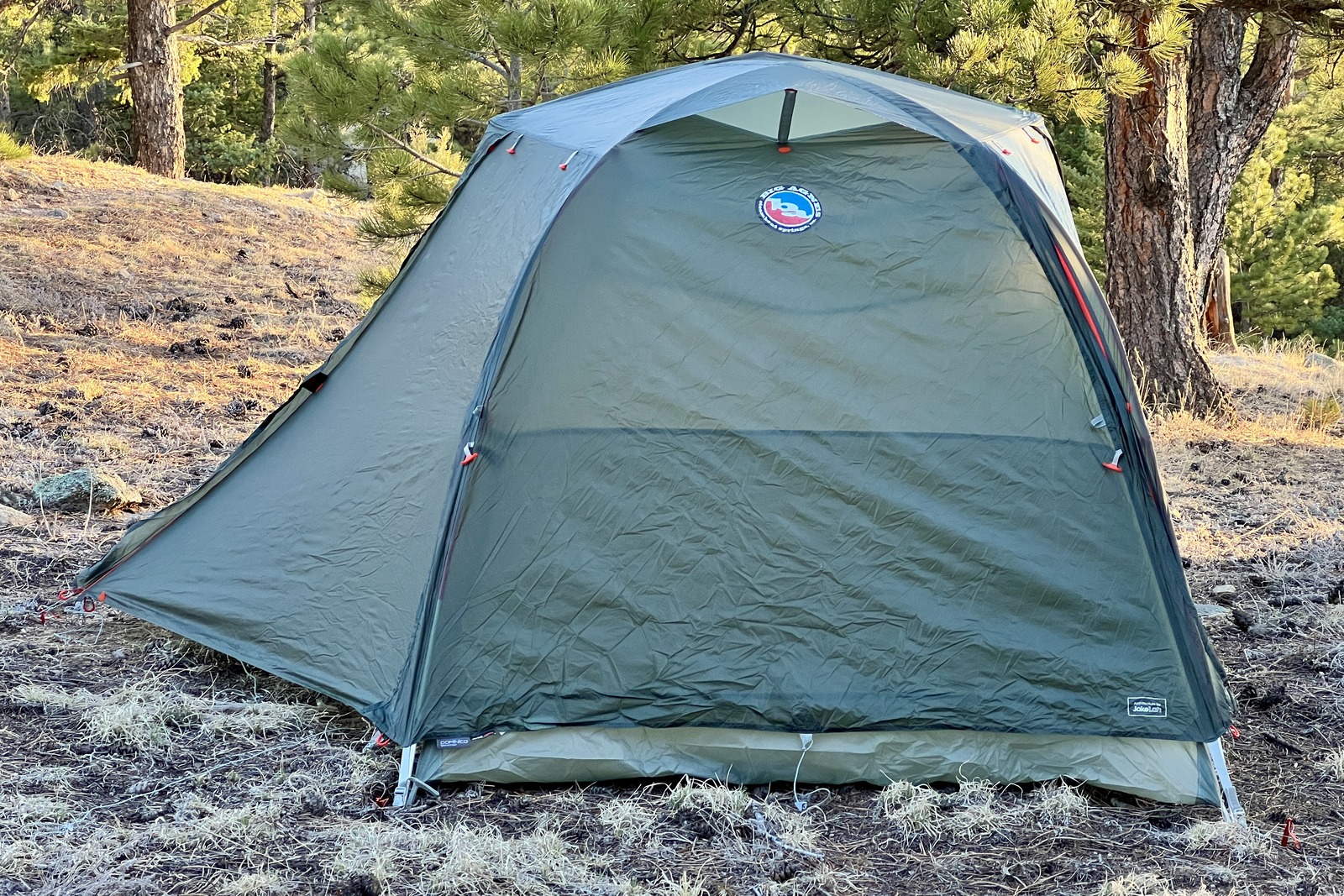 a big agnes tent sits pitched in a forest