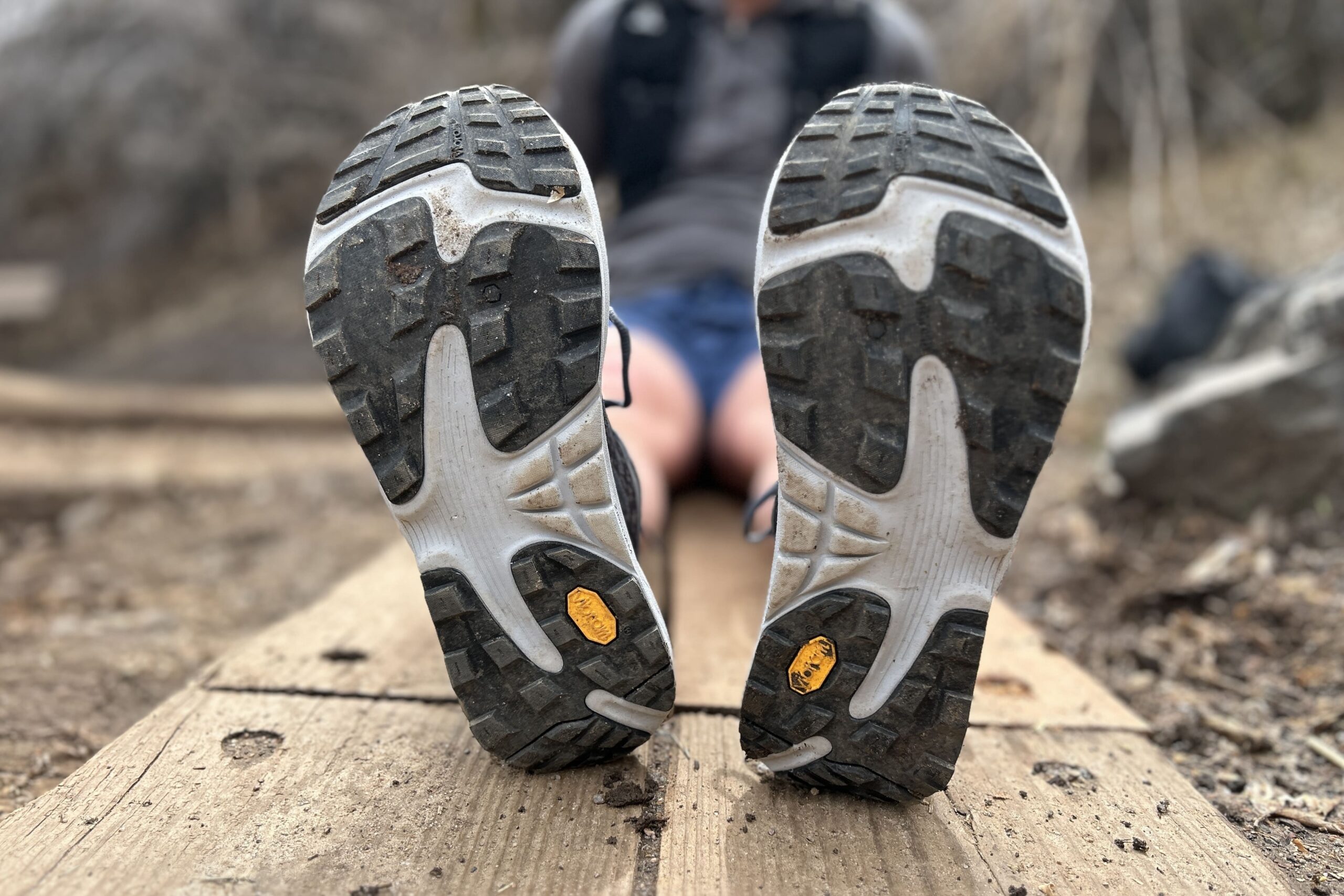 Image of the bottom of a pair of trail runners, showing off the tread.
