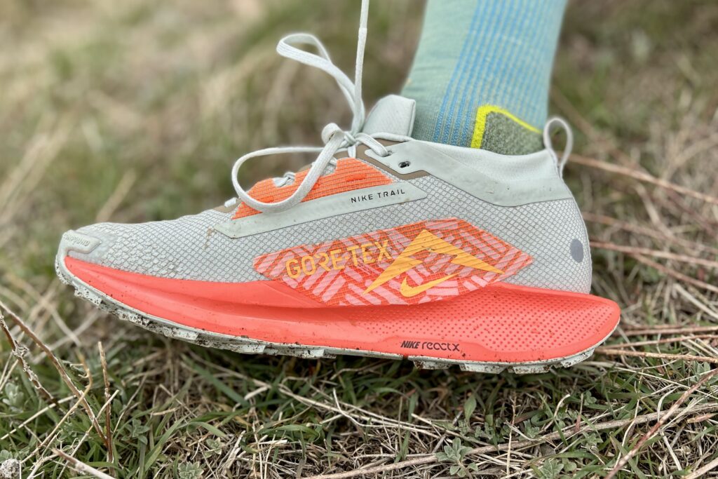 Close up of a trail running shoe from the side.