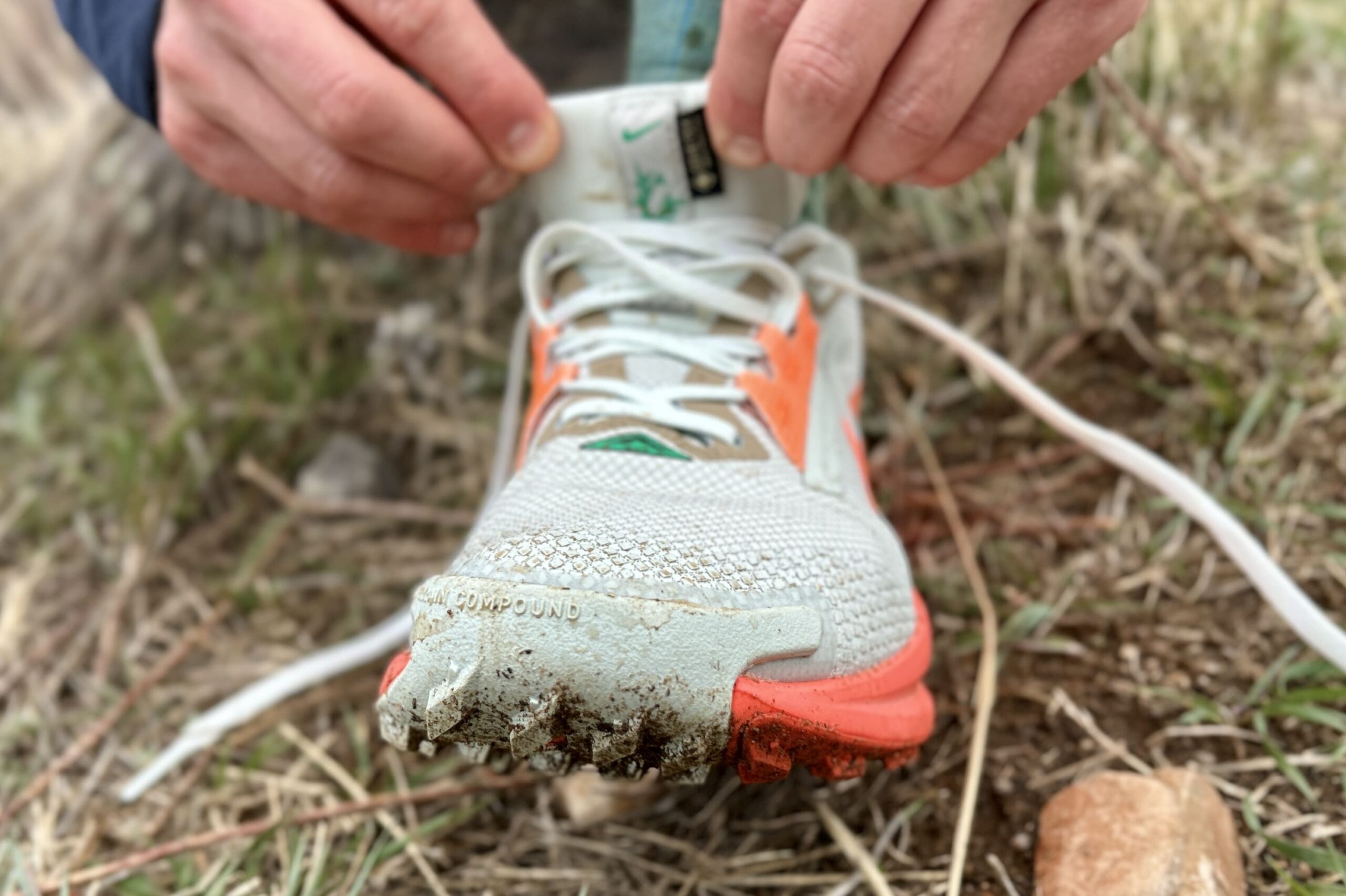 Close up of the winged, thick toecap on a trail running shoe.