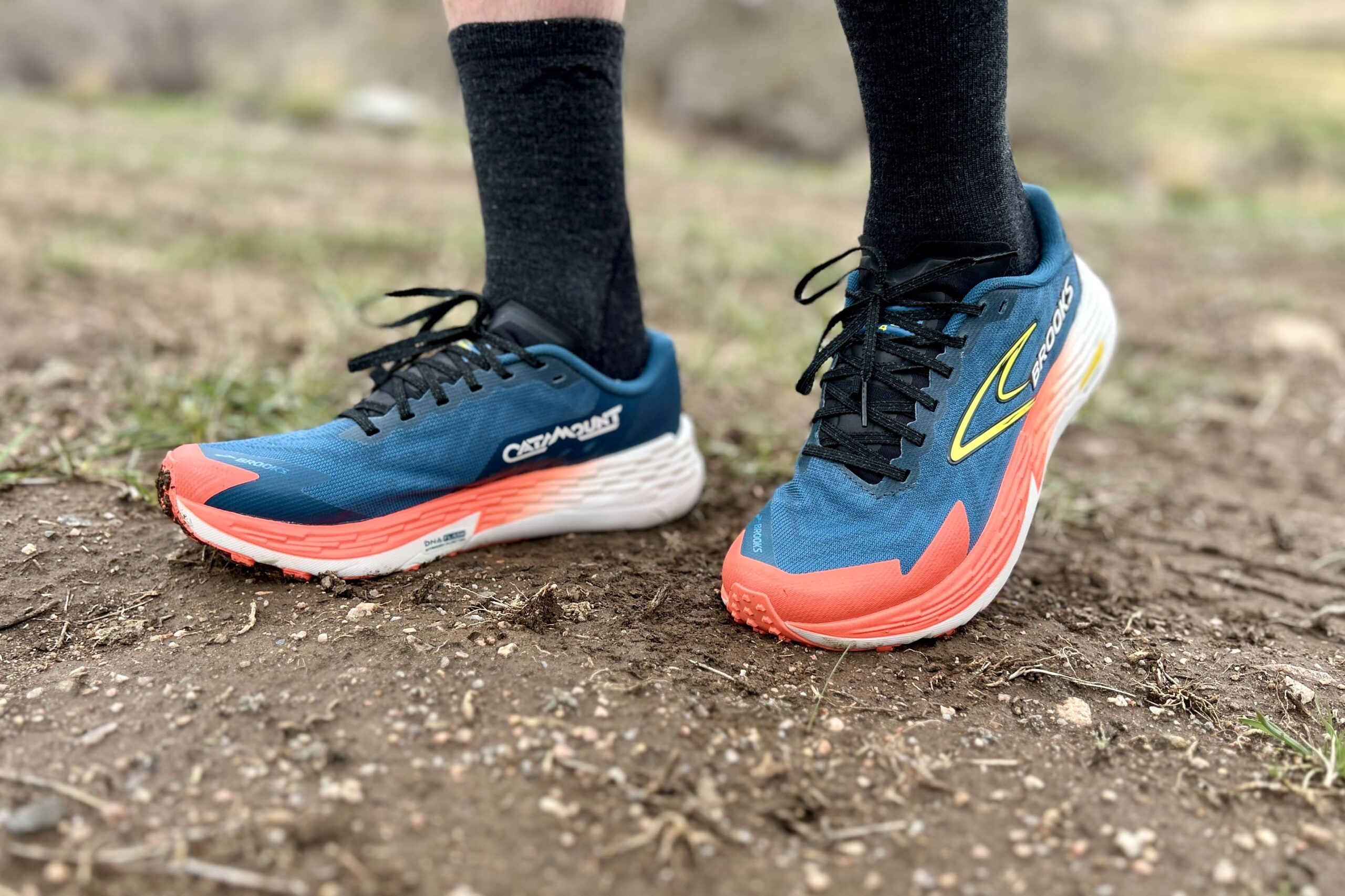 Close up from ankles down of a person in trail running shoes