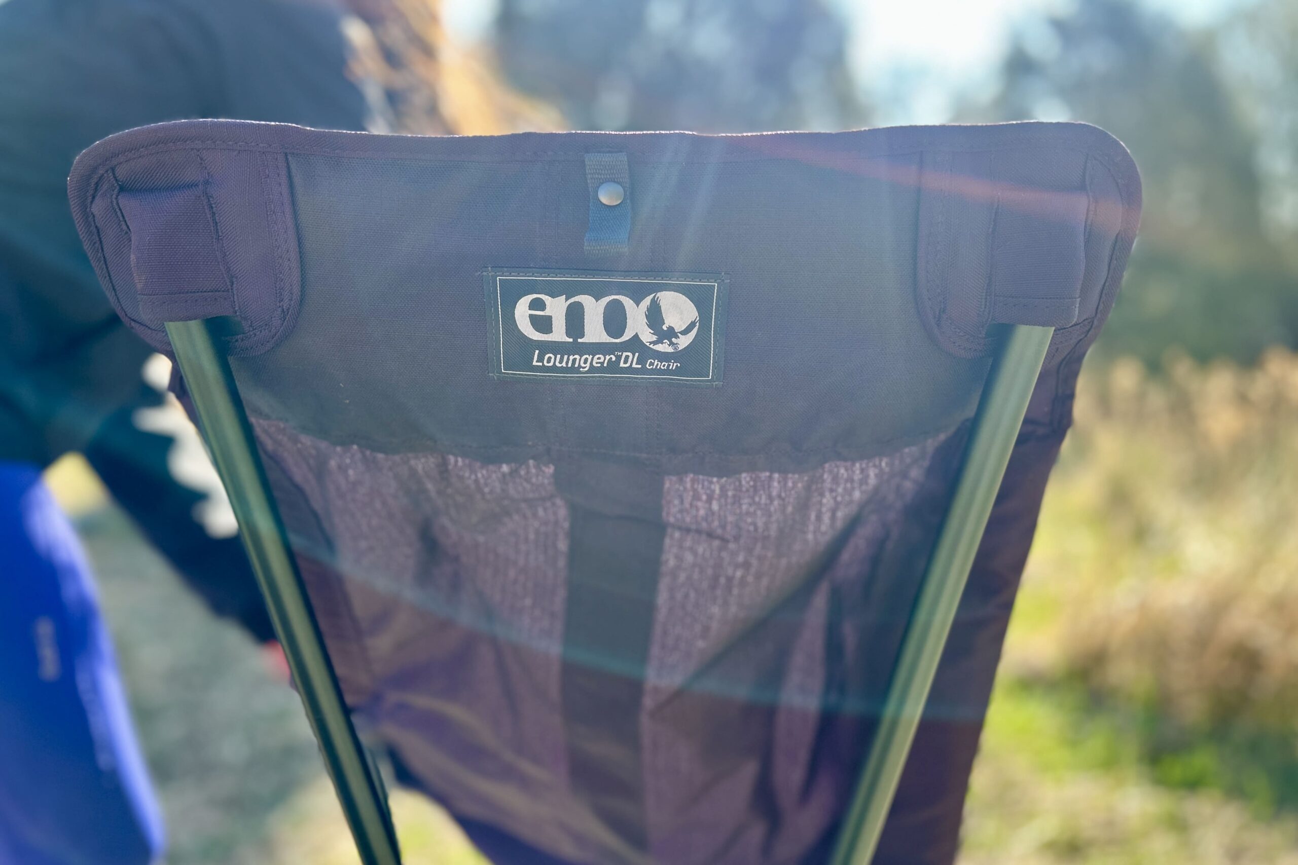 Close up of the back of a camping chair with the logo visible.