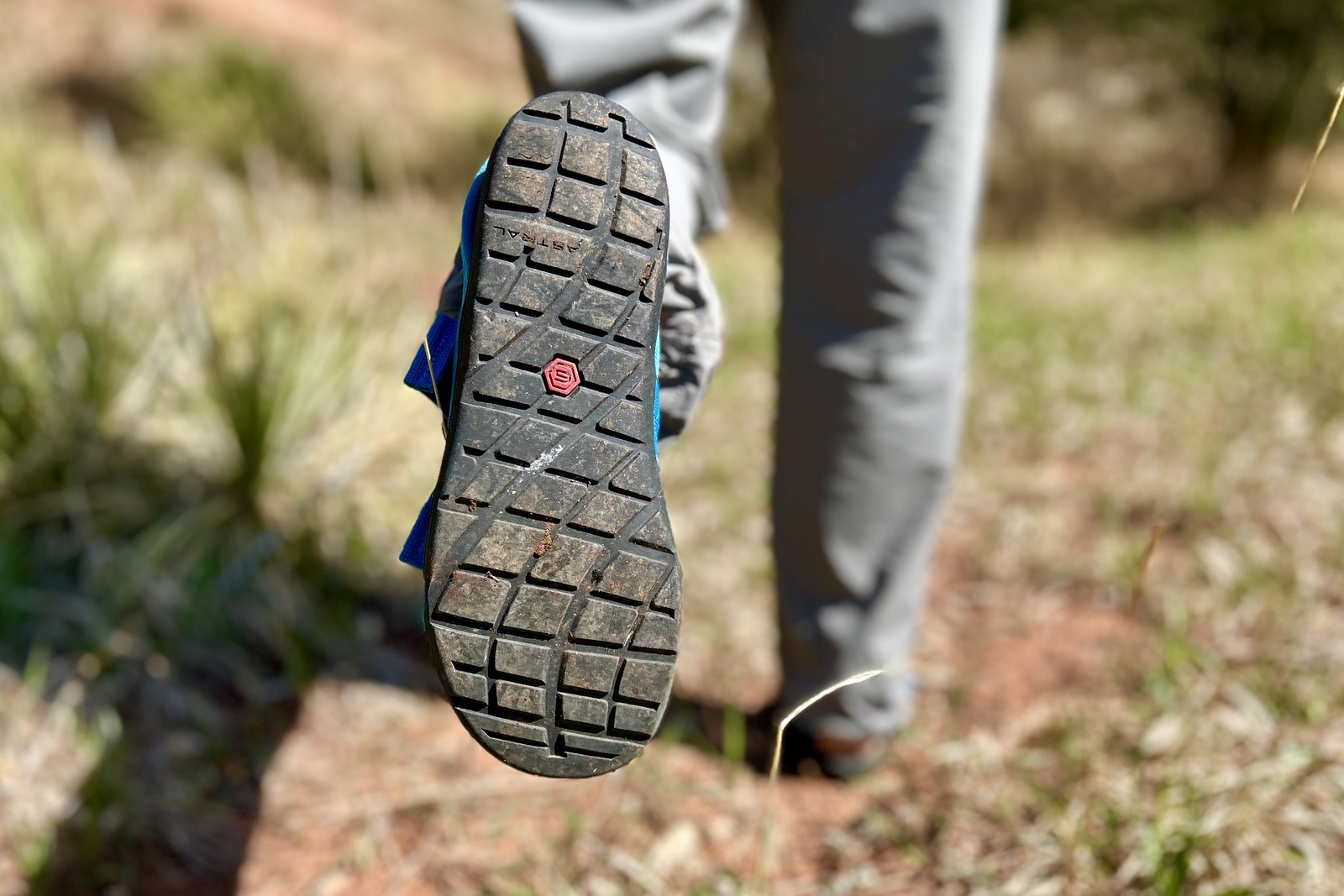 Close up image of the bottom of a pair of hiking sandals so the traction is visible.