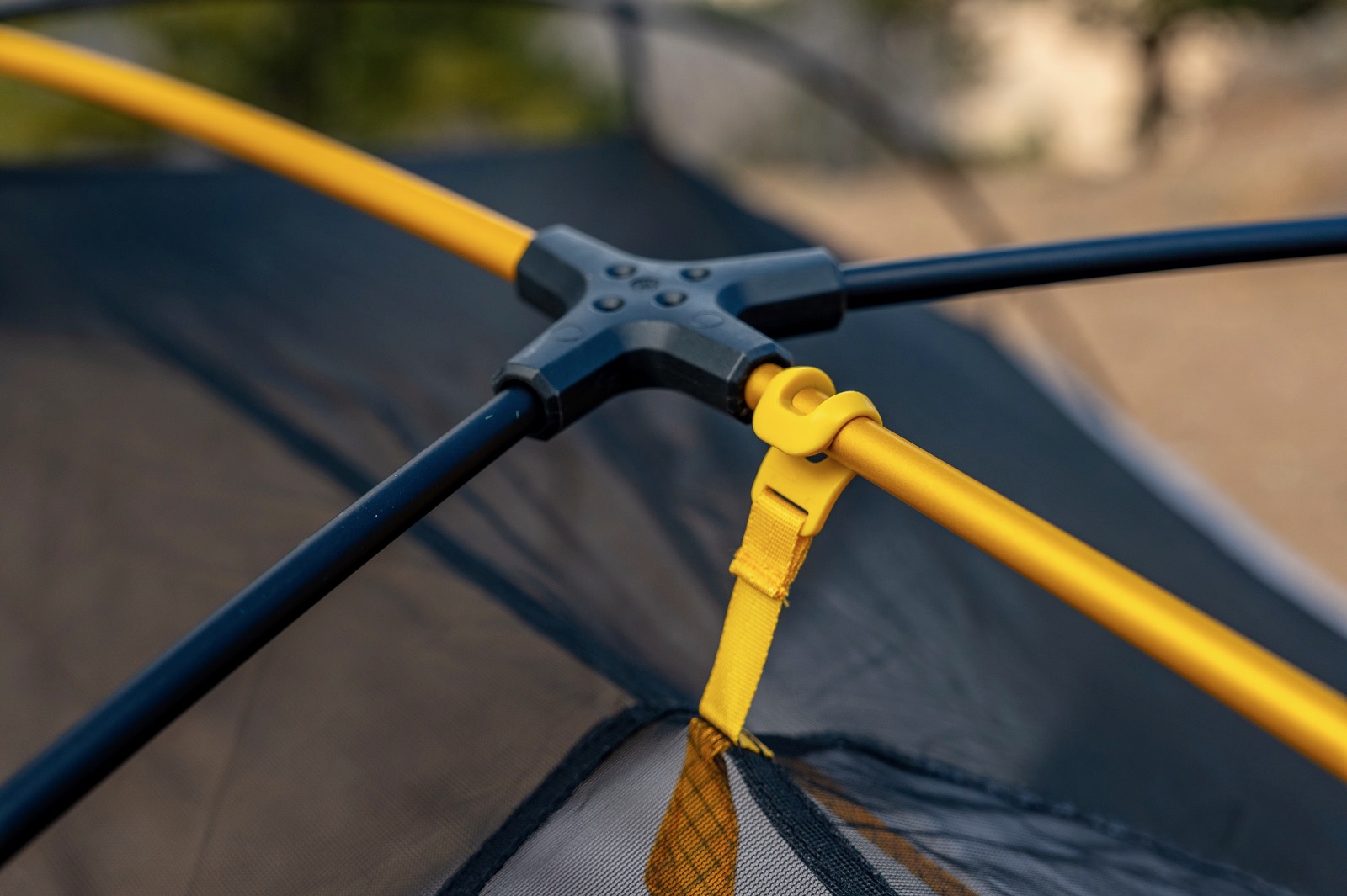 a close up of a tent pole hub section