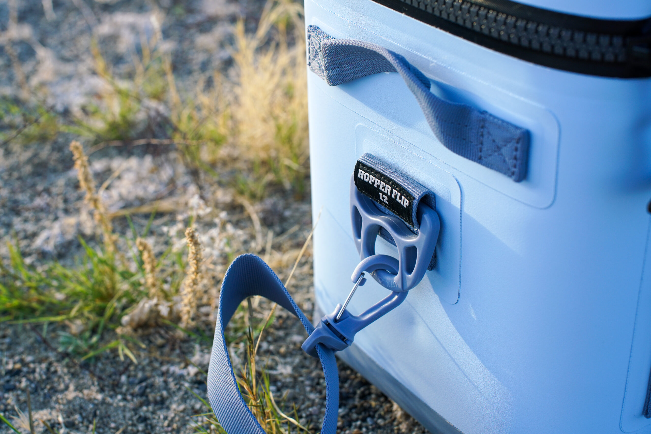 A close up of the attachment point for the removable shoulder strap on the YETI Hopper Flip 12 cooler.