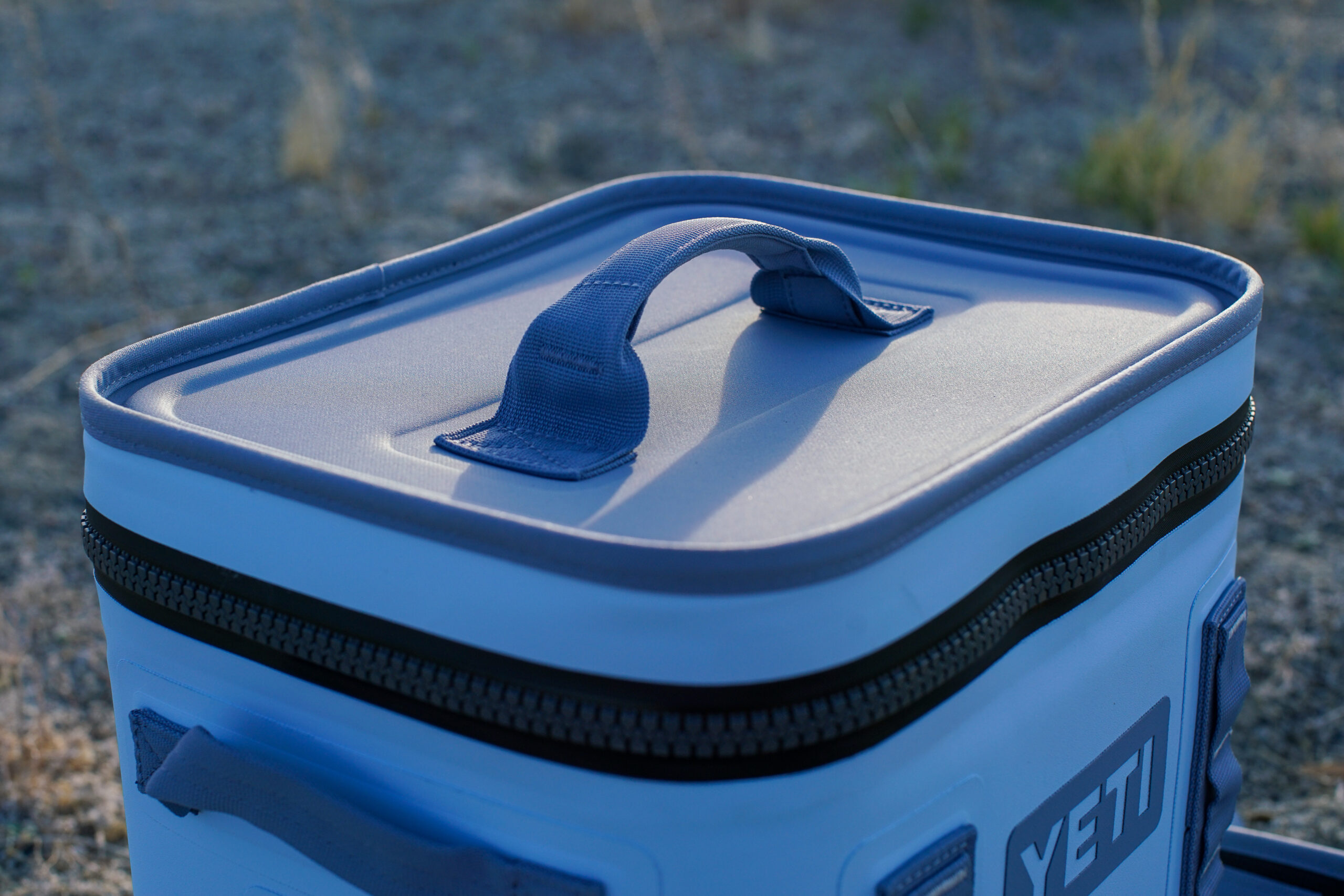 A close up of the top handle on the lid of the YETI Hopper Flip 12 cooler.