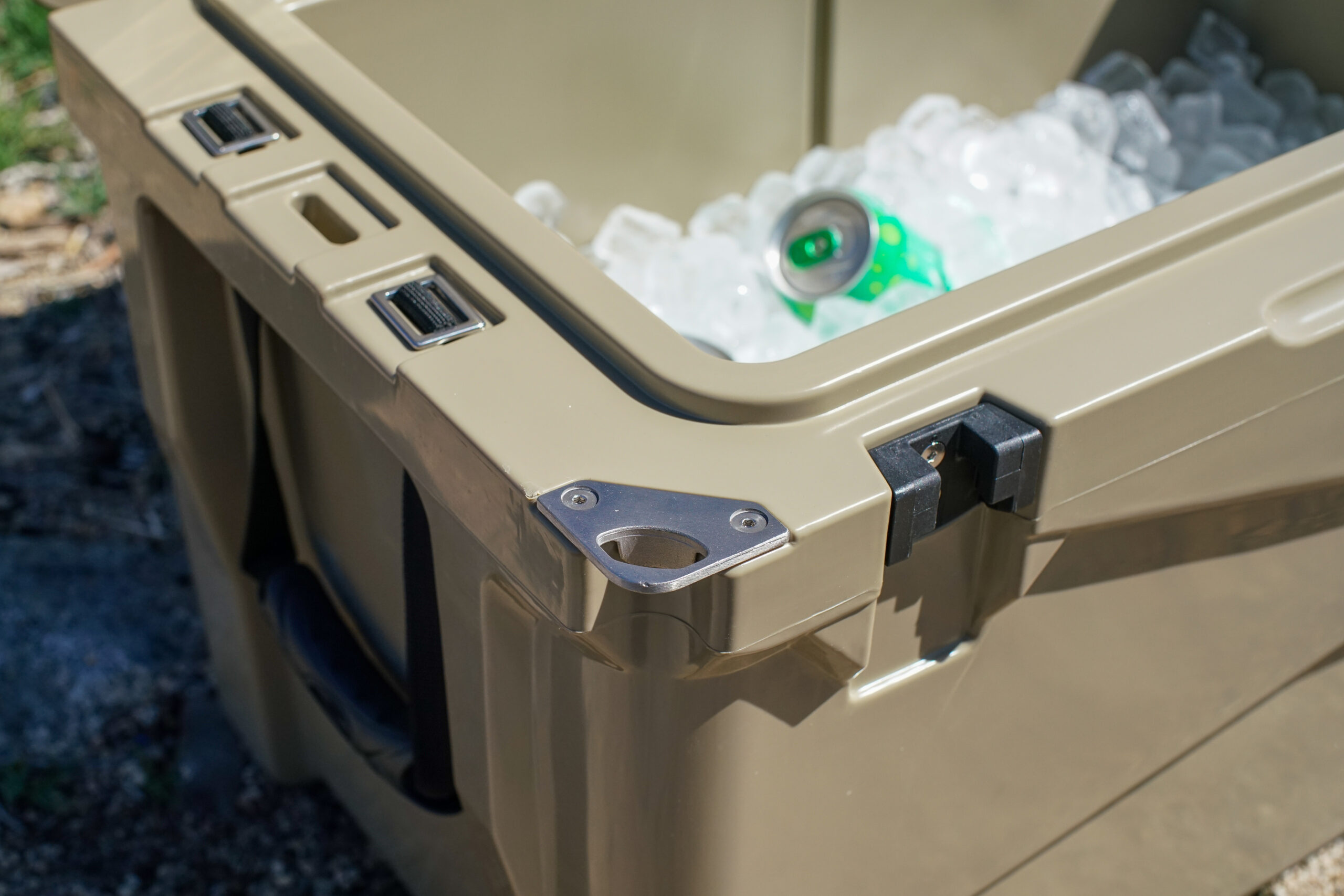 A close up of the corner of the XSpec 60QT, showcasing the built-in bottle opener.