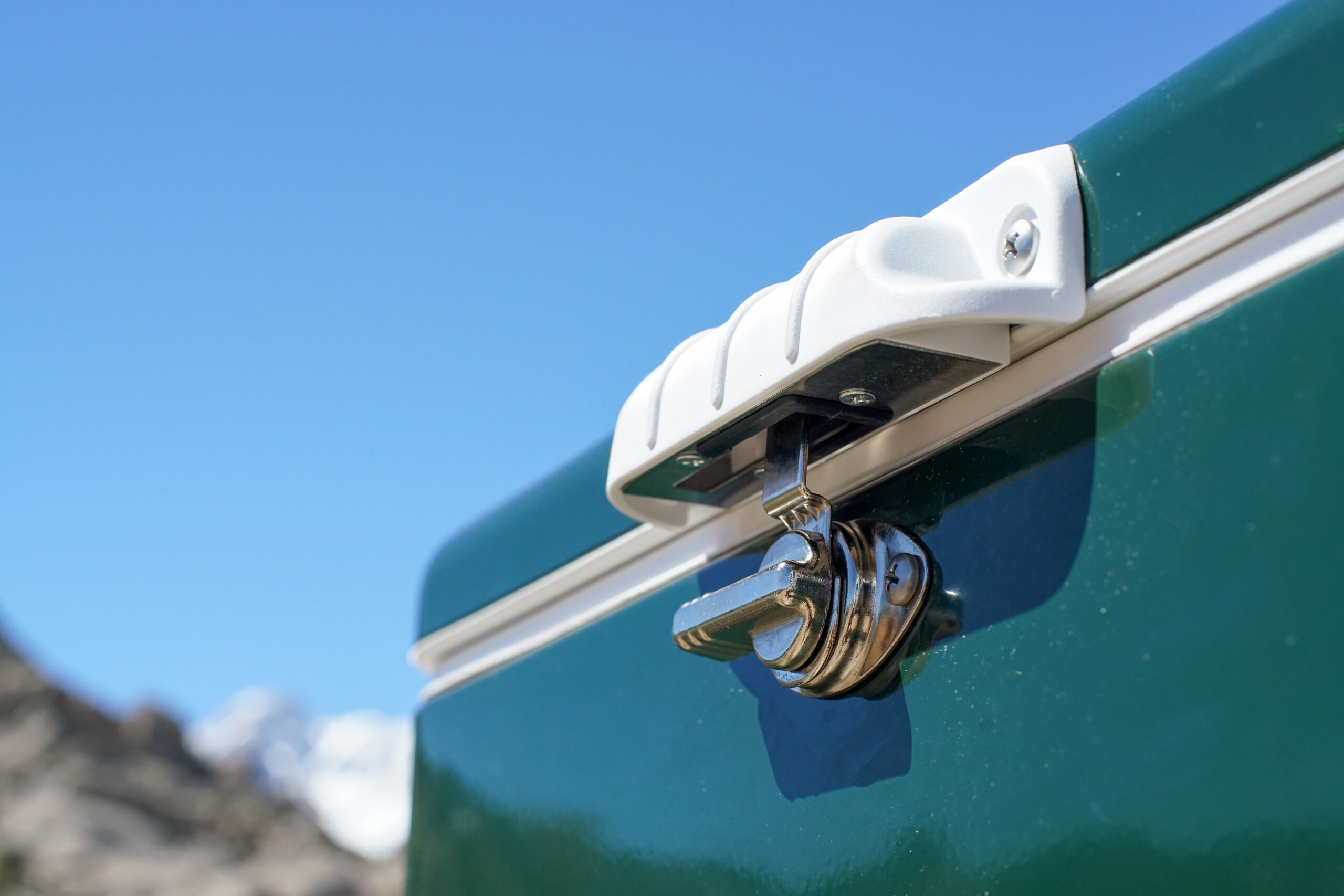 A close up of the Coleman Steel Belted cooler's metal lid latch.