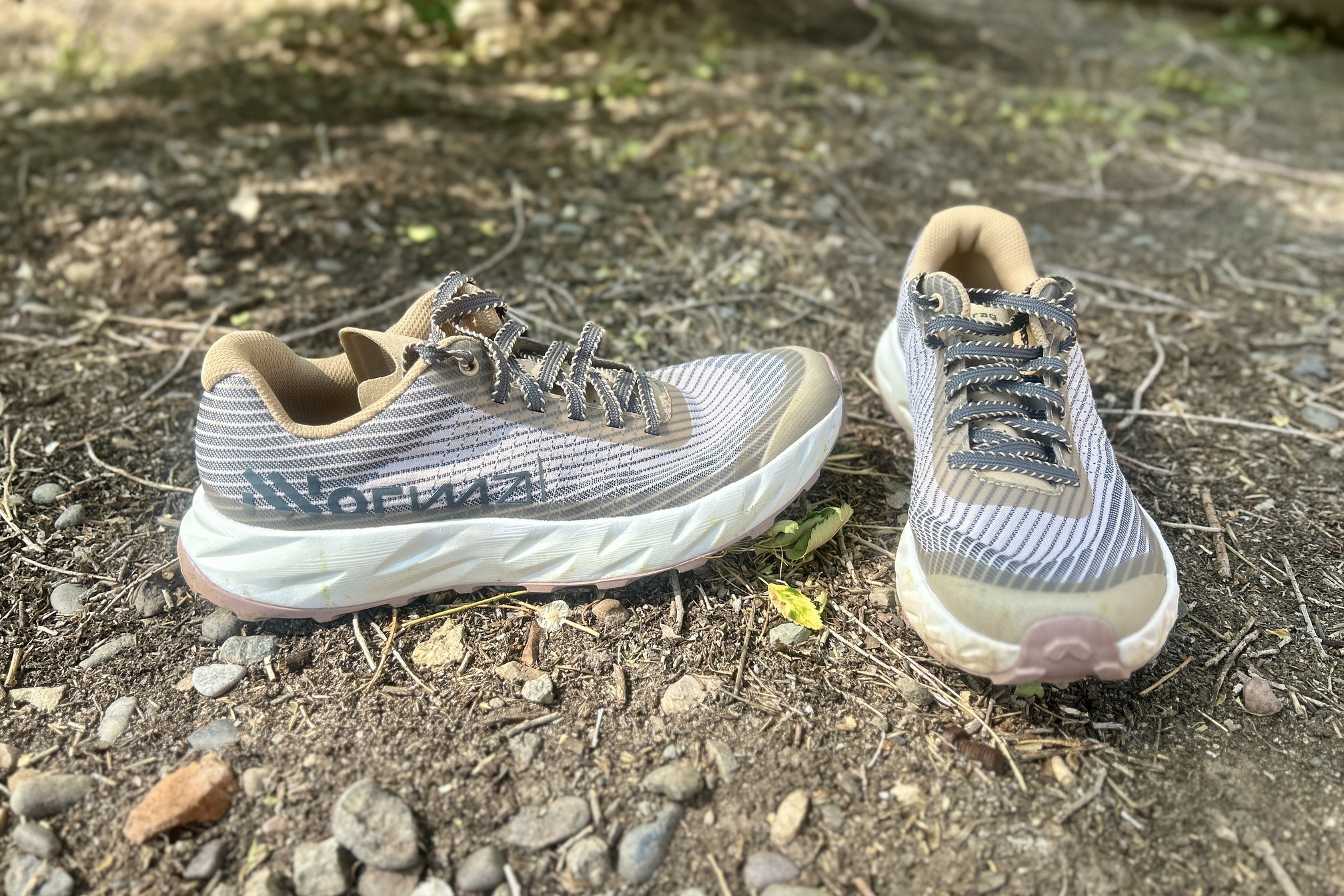 Close up of a pair of trail runners from straight on and from the side.