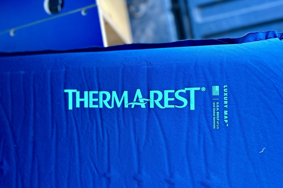Close up image of a camping mattress with brand name decals visible.